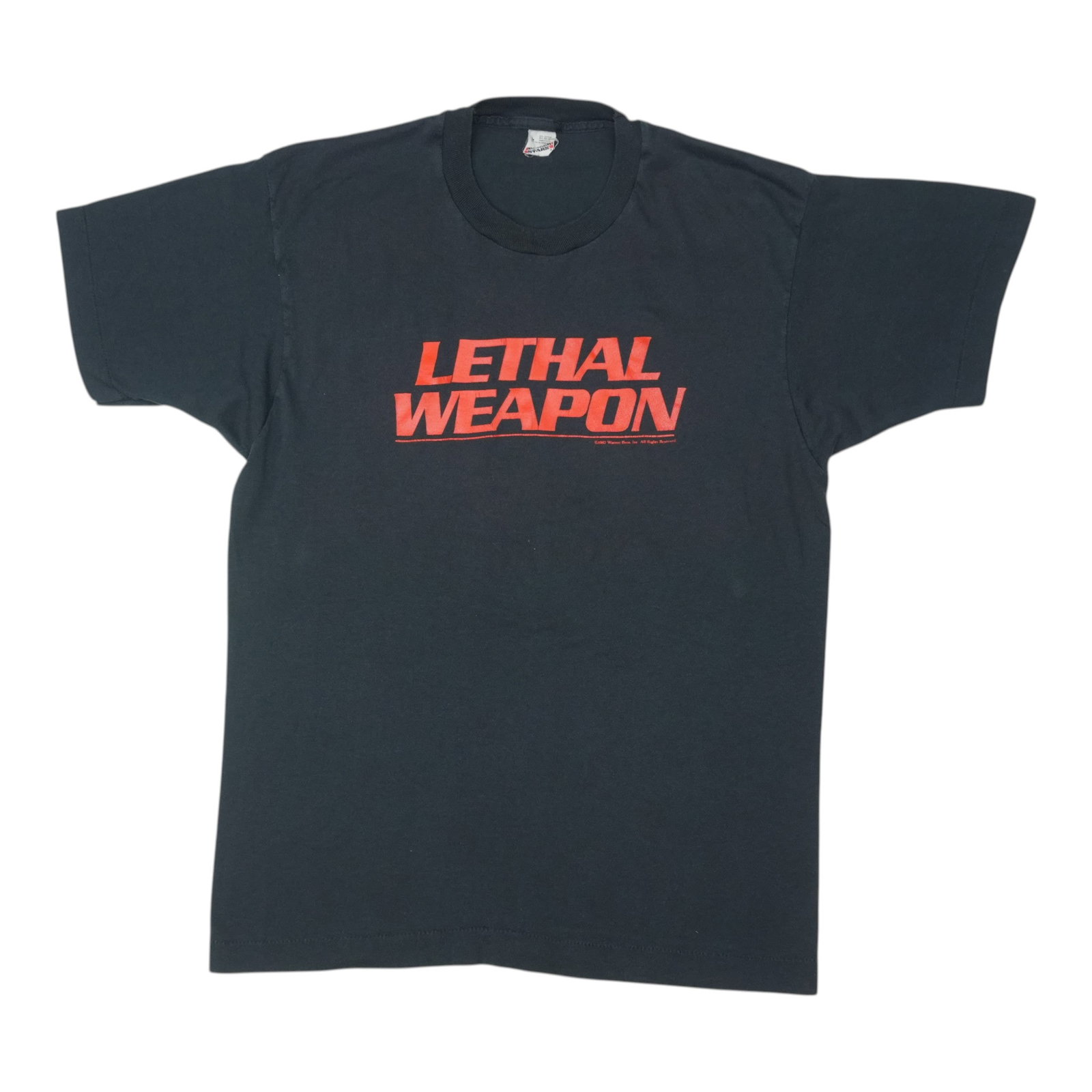 Vintage 1987 Black Poly Cotton Lethal Weapon Movie Shirt Large: Vintage 1987 Black Poly Cotton Lethal Weapon Movie Shirt Large This is an original vintage 1987 Lethal Weapon shirt made from a 50/50 polyester and cotton blend. It features a black color and no graph
