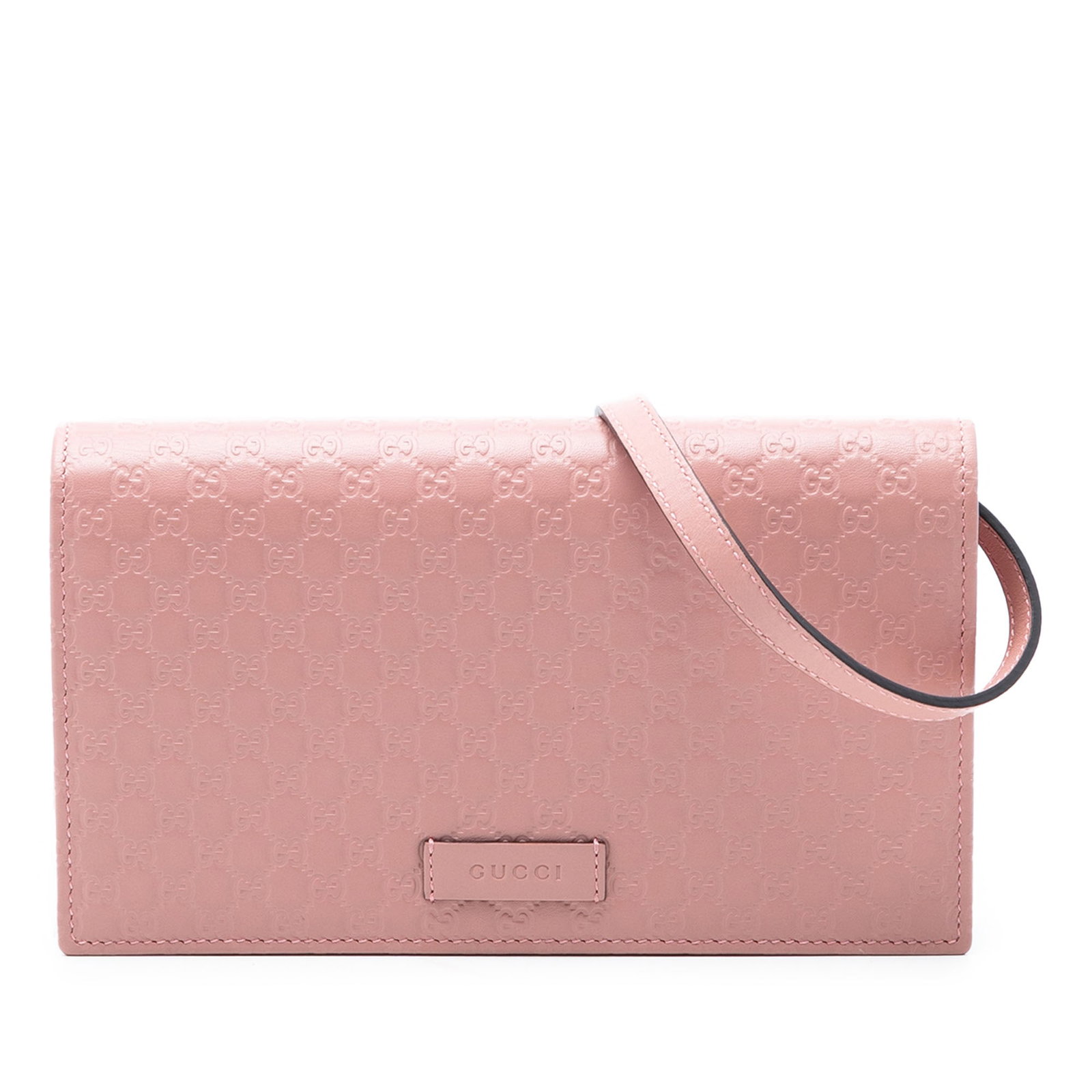 Gucci pink leather crossbody wallet strap bag: Gucci pink leather crossbody wallet strap bag This Gucci Microguccissima Wallet on Strap is crafted from embossed pink leather and features an adjustable flat leather strap, a front flap with magnetic