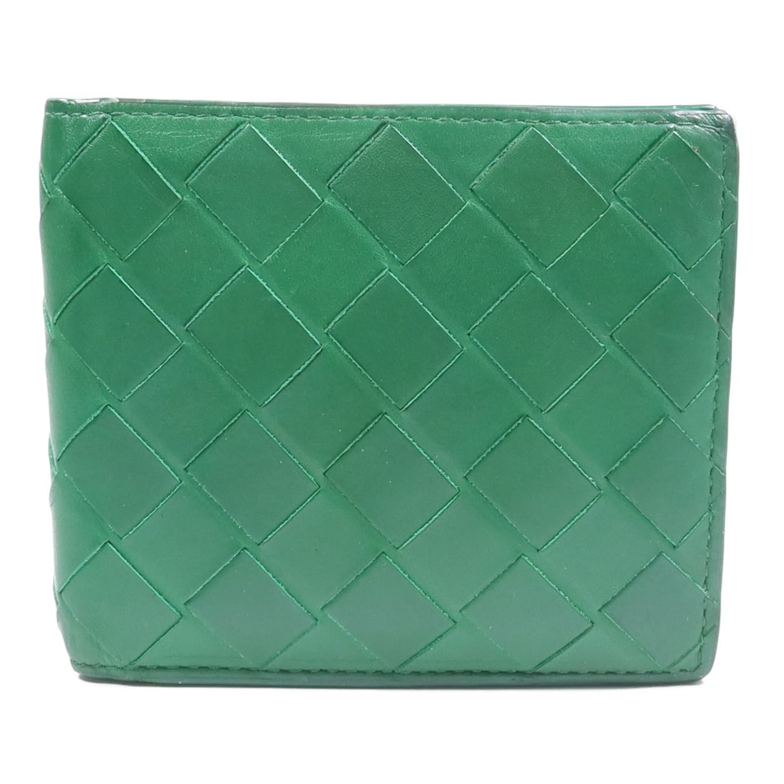 Bottega Veneta Intrecciato Green Calfskin Bi Fold Wallet: Bottega Veneta Intrecciato Green Calfskin Bi Fold Wallet A BOTTEGA VENETA bi-fold wallet in green Intrecciato leather, made from calfskin (cowhide). Designed in a regular mens size, it is made in Ital