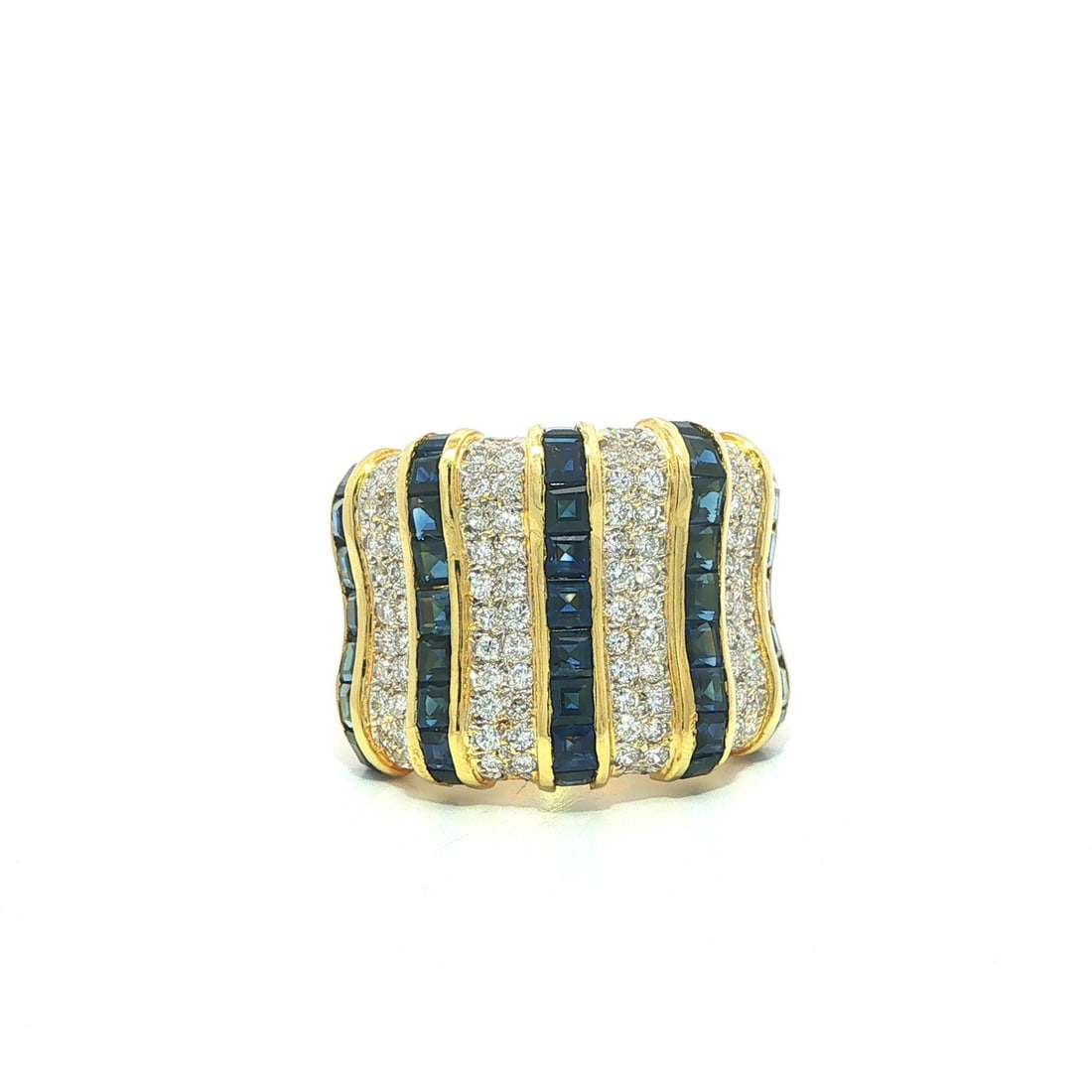 18k Yellow Gold Sapphire Diamond Wide Band Ring Vintage: 18k Yellow Gold Sapphire Diamond Wide Band Ring Vintage This vintage wide band ring is crafted from solid 18k yellow gold and features a striking design set with 41 natural square step cut sapphires i