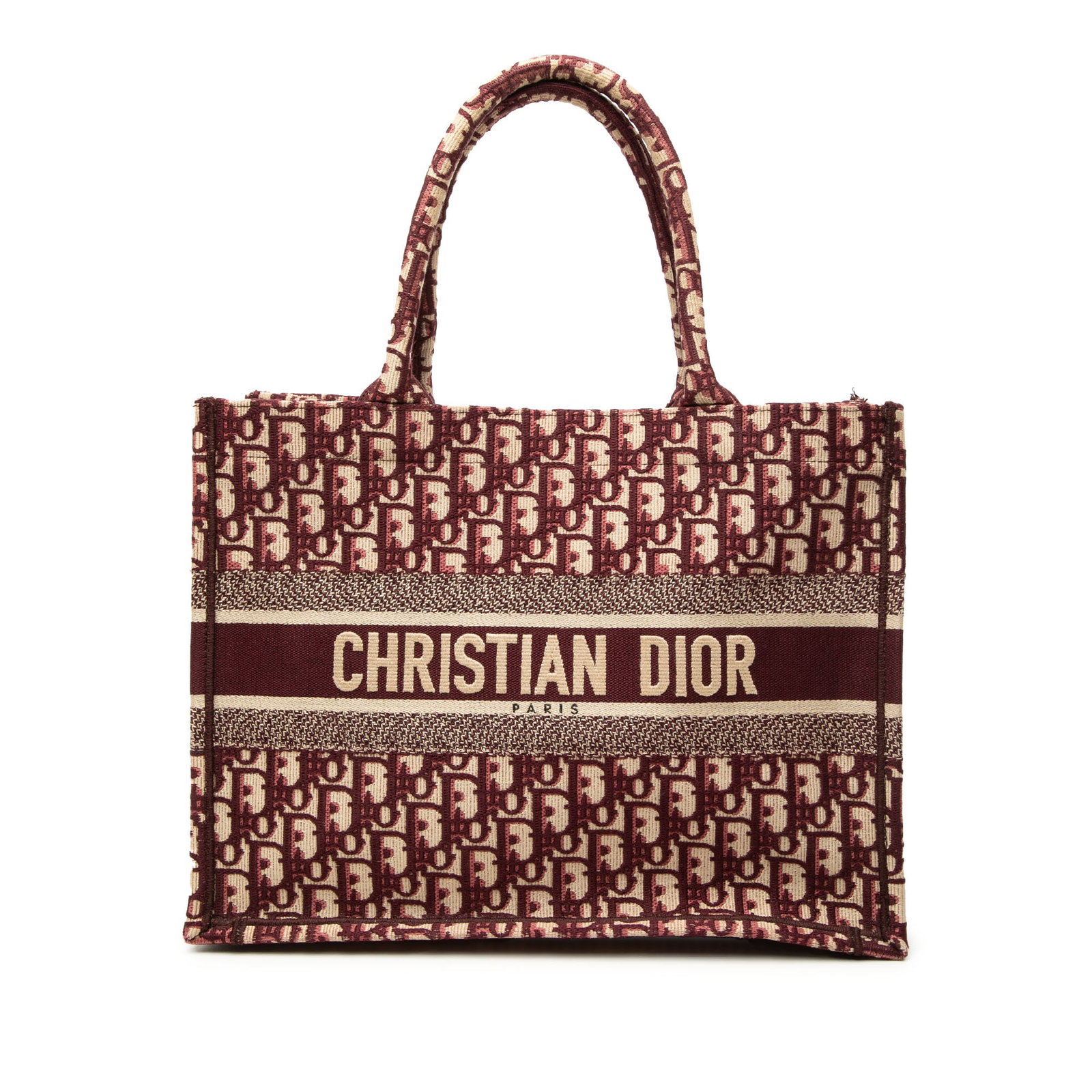 Dior Medium Book Tote in Red Oblique Embroidered Canvas: Dior Medium Book Tote in Red Oblique Embroidered Canvas This Dior Medium Oblique Embroidered Canvas Book Tote is crafted in embroidered canvas with rolled canvas handles and an open-top design. The ba