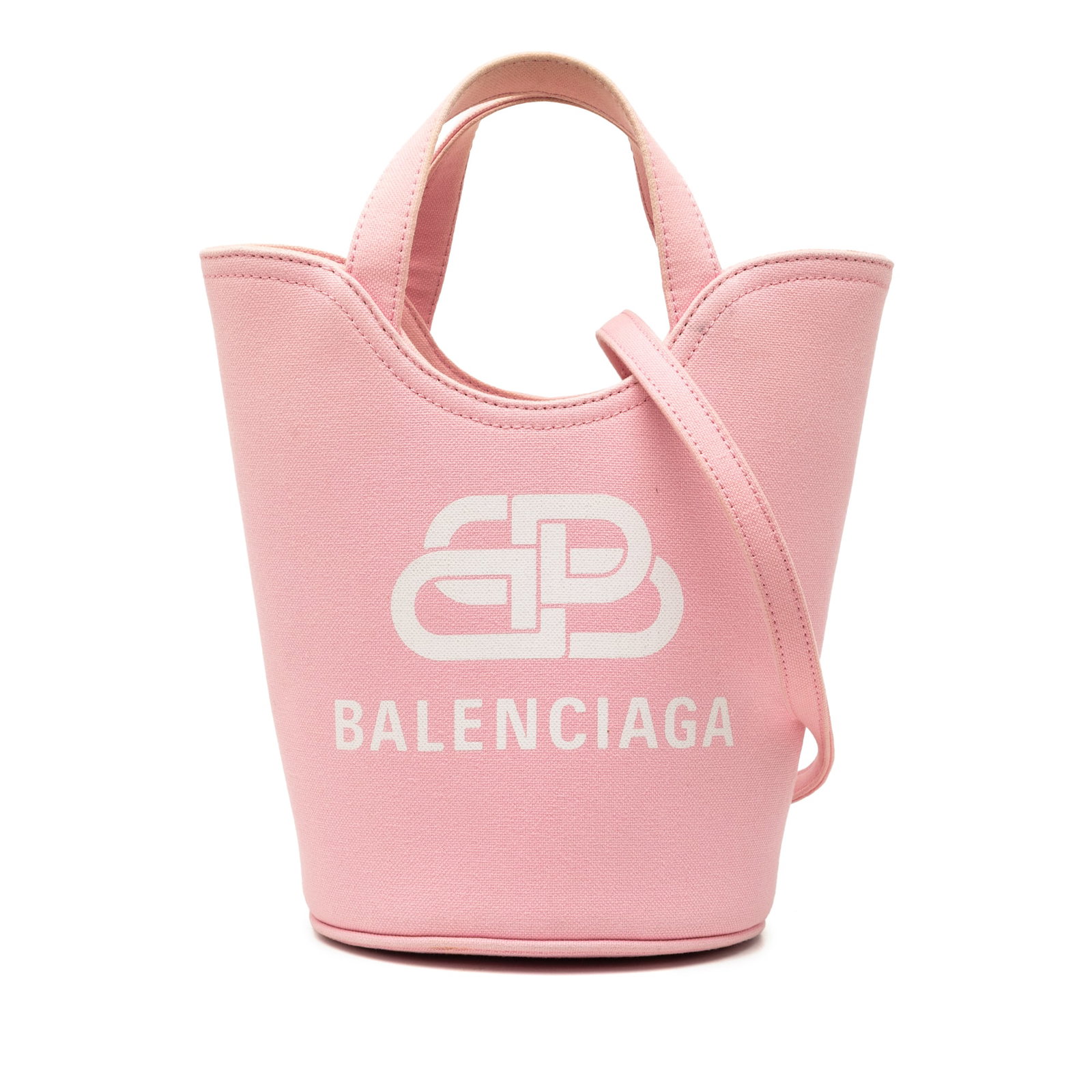 Balenciaga Pink XS Wave Canvas Bucket Bag: Balenciaga Pink XS Wave Canvas Bucket Bag This Balenciaga XS Canvas Wave Bucket Bag is crafted from pink fabric and features a distinctive wave silhouette. It is designed with flat handles and comes w