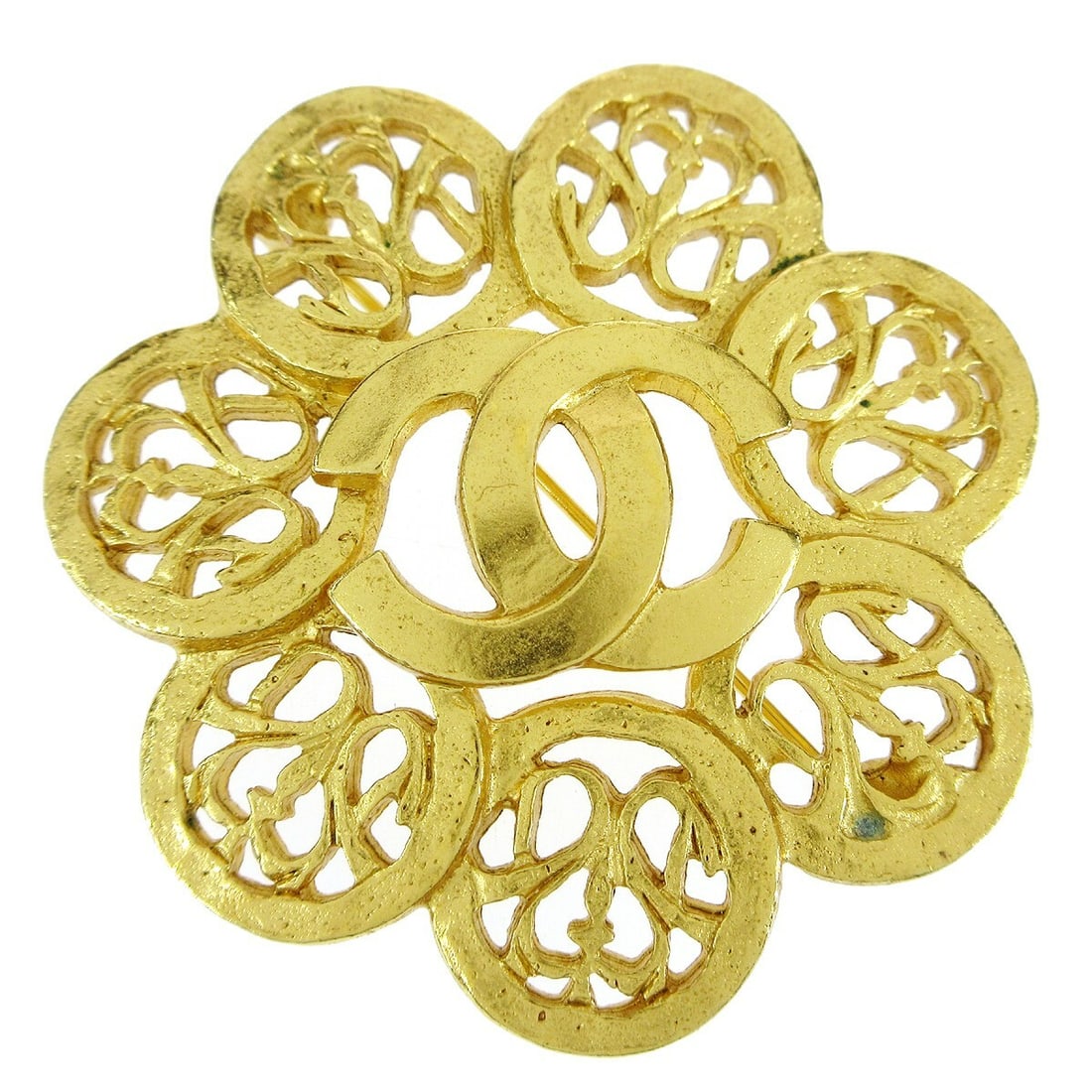 CHANEL 95A Gold Plated Flower Brooch France: CHANEL 95A Gold Plated Flower Brooch France Gold-plated Chanel flower brooch pin made in France. This brooch features a floral corsage design and is marked 95A. Condition is very good with light signs