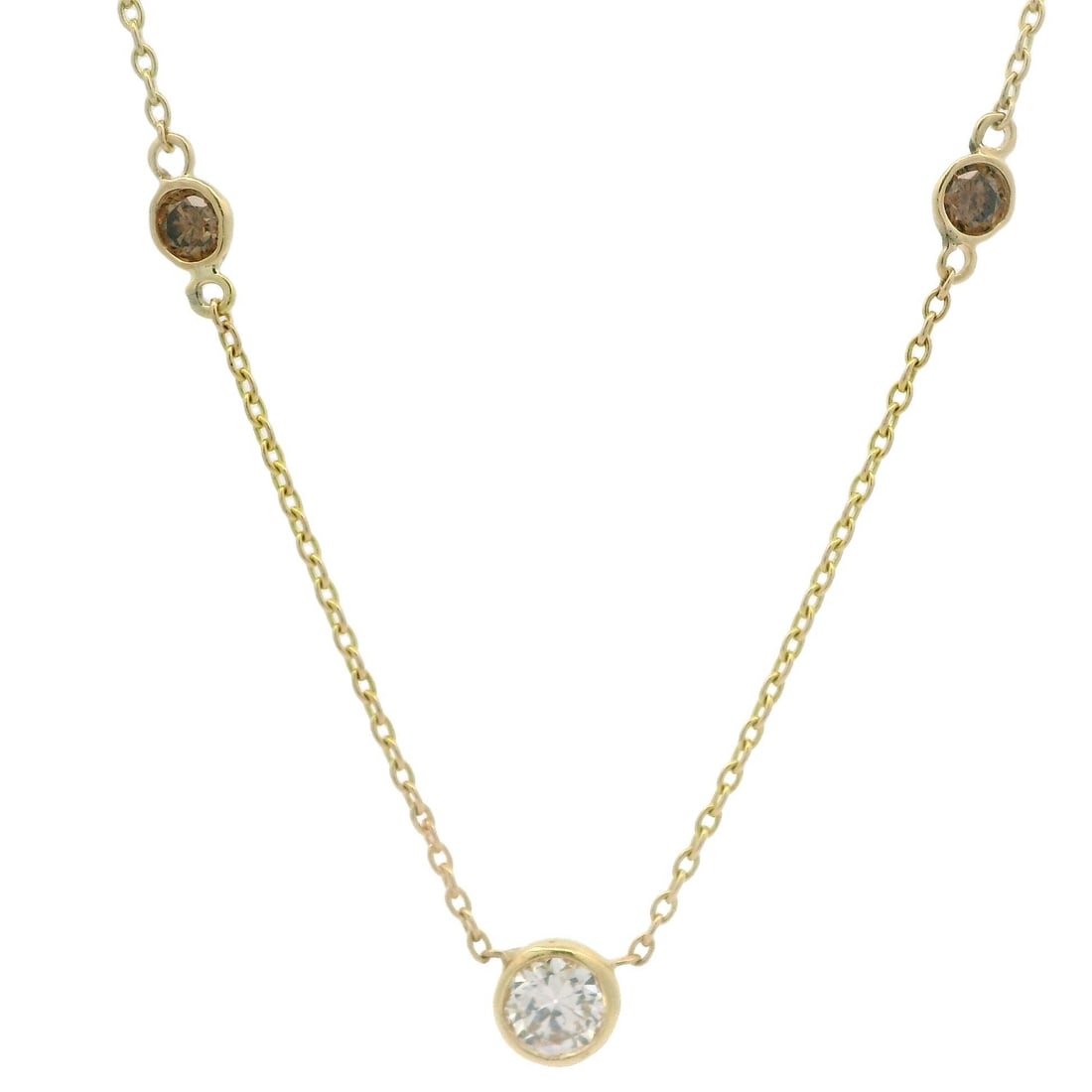 Vintage 18k Yellow Gold 1.12ct Diamond Station Necklace: Vintage 18k Yellow Gold 1.12ct Diamond Station Necklace This stunning vintage necklace features a captivating arrangement of natural diamonds set in luxurious yellow gold. The piece showcases a total 