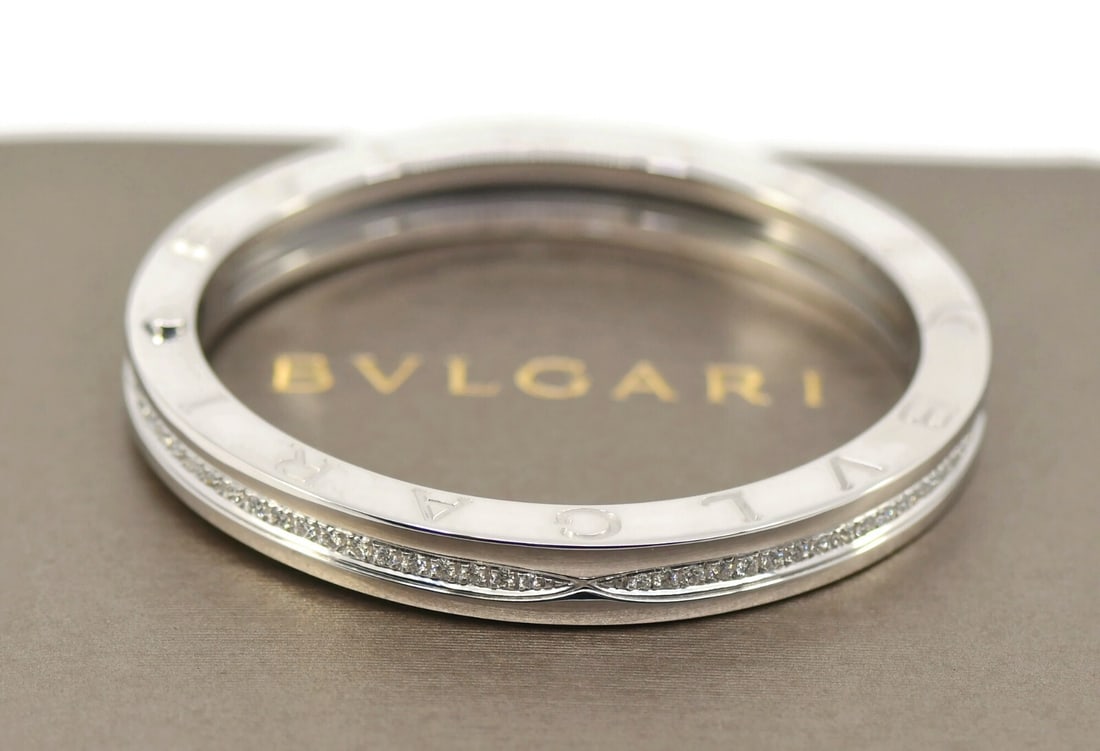 Bvlgari B.zero1 Small White Gold and Diamond Bangle Bracelet 18k: Bvlgari B.zero1 Small White Gold and Diamond Bangle Bracelet 18k This pre-owned Bulgari B.Zero1 bracelet features 18K white gold and is adorned with diamonds. The bracelet is a small size bangle from 