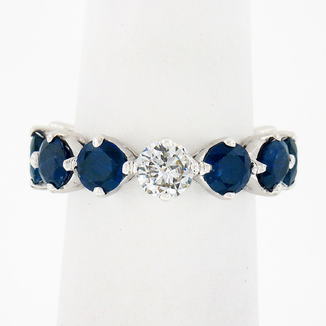 14k White Gold Sapphire Diamond Eternity Wedding Band Ring 4.74ctw: 14k White Gold Sapphire Diamond Eternity Wedding Band Ring 4.74ctw This exquisite 14k white gold eternity band ring features a stunning arrangement of alternating round brilliant cut royal blue sapphi