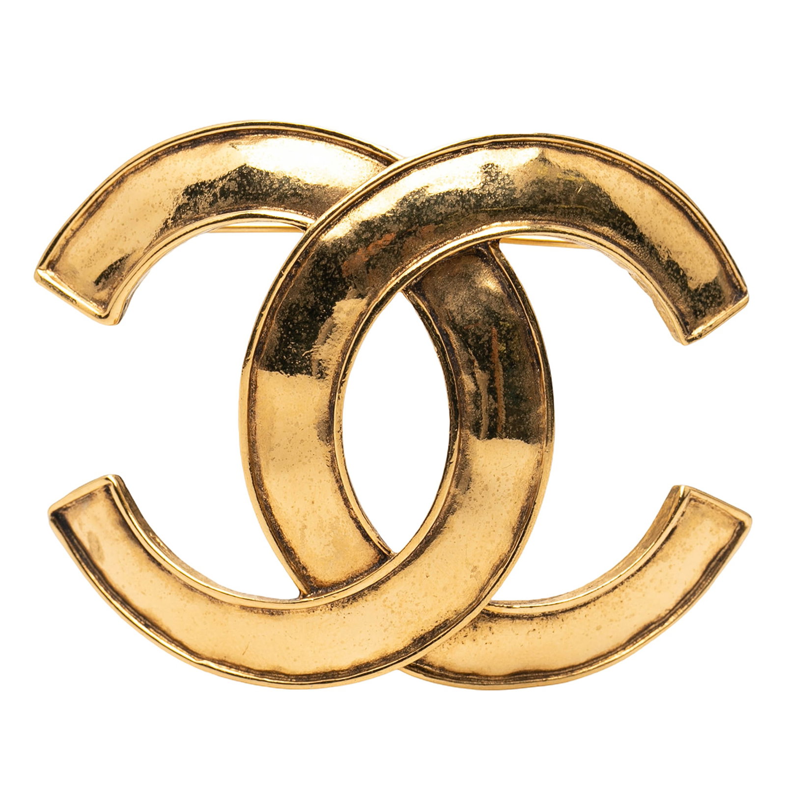 Gold Tone Metal Brooch with Chanel CC Motif: Gold Tone Metal Brooch with Chanel CC Motif This Chanel CC brooch features a gold-tone metal body and a back pin closure. The brooch is designed in a classic costume jewelry style and is crafted in Fr