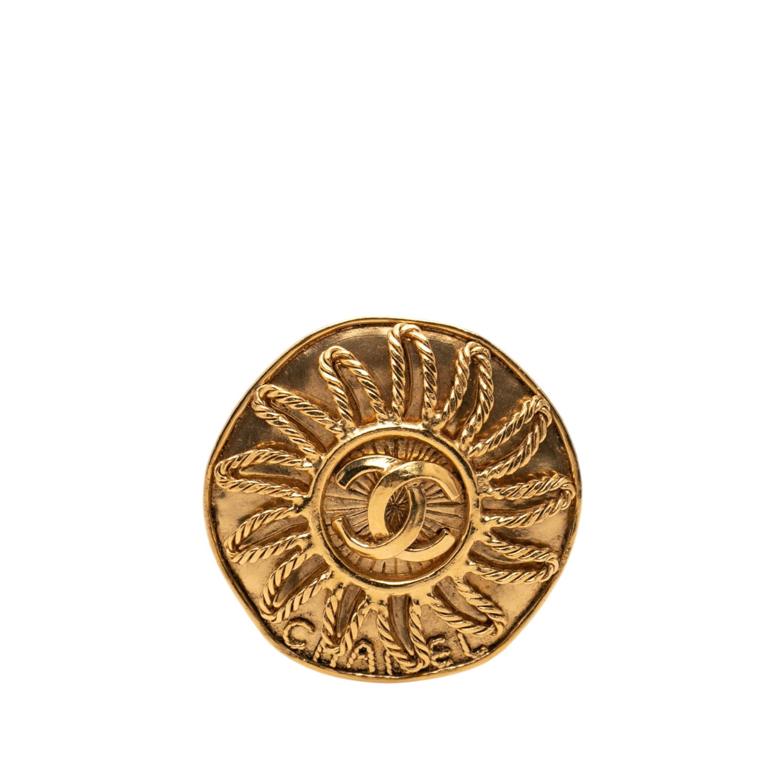 Chanel CC Sunburst Gold Tone Metal Brooch: Chanel CC Sunburst Gold Tone Metal Brooch Chanel CC Sunburst brooch in gold tone metal with a back pin closure. This costume jewelry piece is made in France and shows scratches to the front, back, and