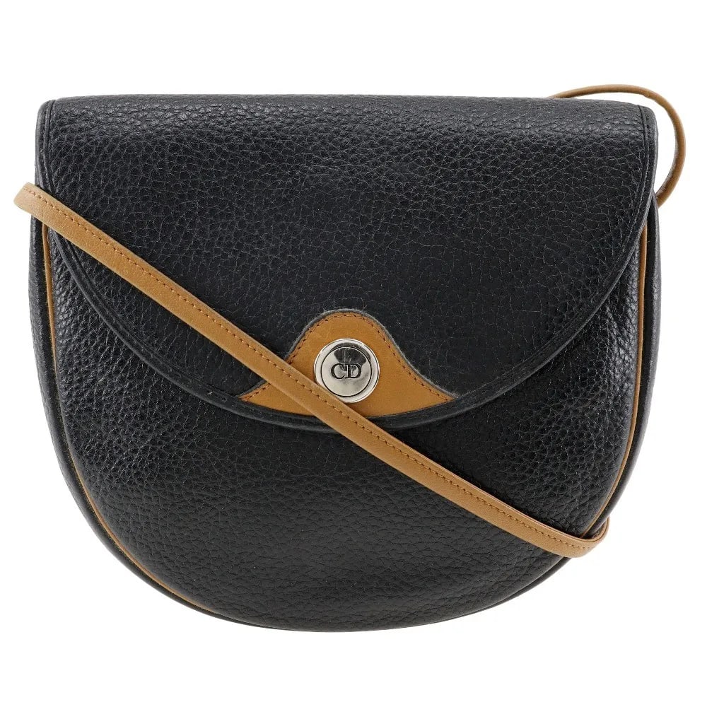 Black Leather CD Shoulder Bag by Christian Dior: Black Leather CD Shoulder Bag by Christian Dior This Christian Dior CD Shoulder Bag is crafted from black leather and designed for women. Made in France, it features a classic silhouette with a should
