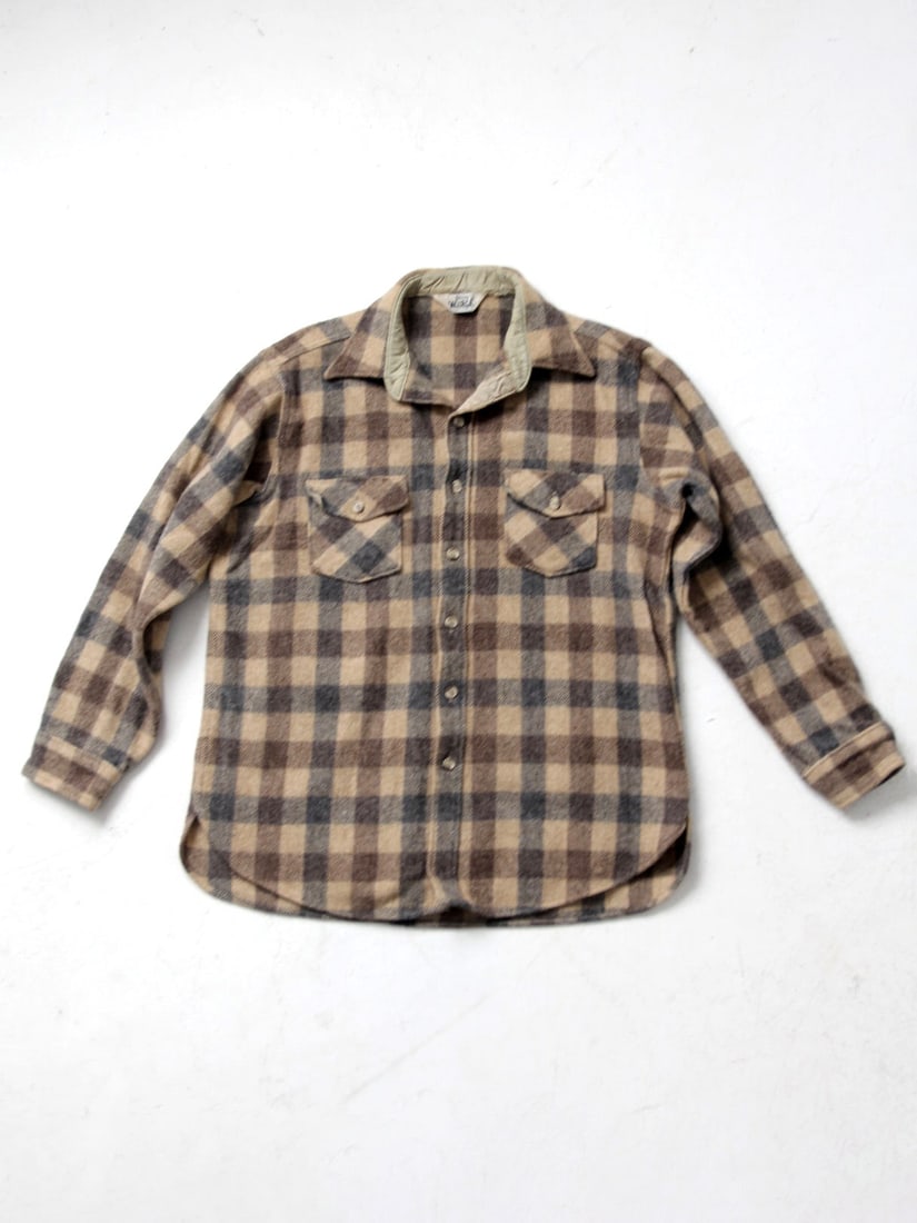 1980s Vintage Woolrich Plaid Wool Shirt with Chest Pockets: 1980s Vintage Woolrich Plaid Wool Shirt with Chest Pockets Experience the warmth and classic style of the 1980s with this vintage Woolrich plaid wool shirt. Designed with a timeless plaid pattern, it 
