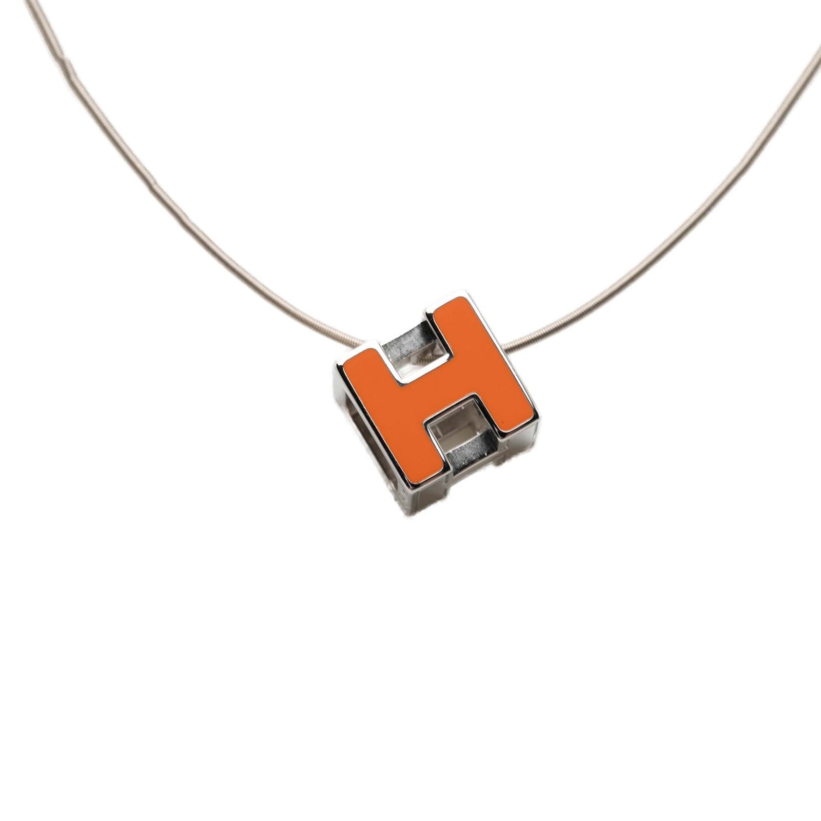 Hermes Cage d H Pendant Necklace Palladium Plated Lacquered Metal: Hermes Cage d H Pendant Necklace Palladium Plated Lacquered Metal This Hermes Cage d H Cube necklace features a palladium plated body with a lacquered pendant and screw closure. It is a costume jewelr