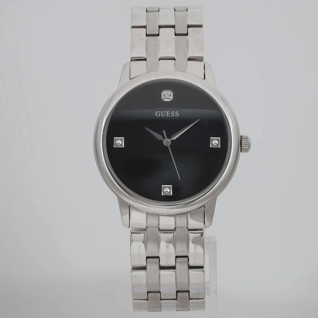 GUESS Tailor 39mm Quartz Watch Black Dial Diamond Markers Gray Steel Bracelet: GUESS Tailor 39mm Quartz Watch Black Dial Diamond Markers Gray Steel Bracelet This Guess Tailor wristwatch combines style and functionality with its casual design and elegant features. The watch featu