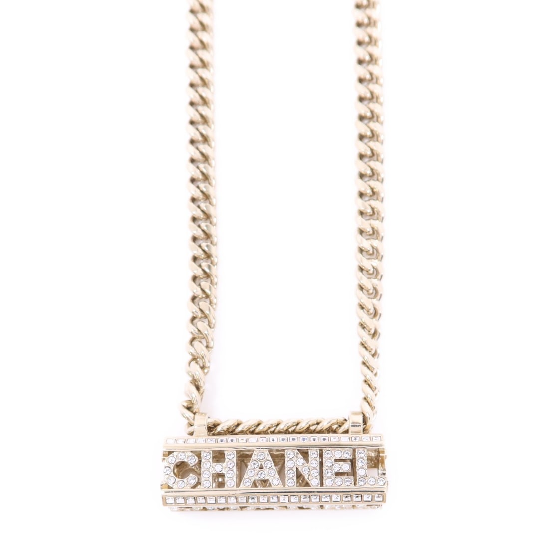 CHANEL Gold Tone Crystal Choker Necklace: CHANEL Gold Tone Crystal Choker Necklace Choker necklace by CHANEL in gold-tone metal with crystal accents and a clear/gold colorway. The piece is described as having reasonable wear and tear and come