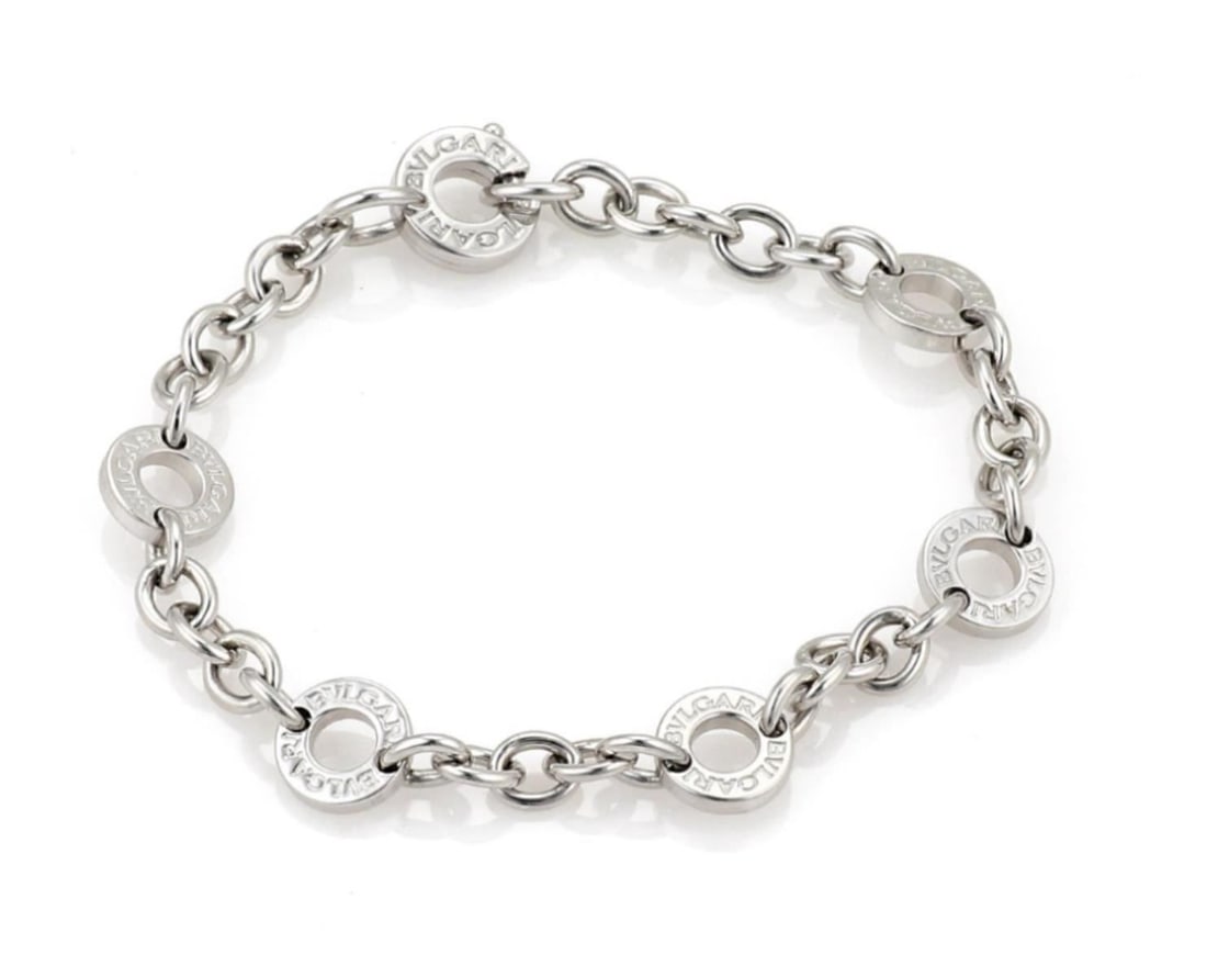 Bvlgari 6 Circle Charm Bracelet in 18k White Gold 6.25": Bvlgari 6 Circle Charm Bracelet in 18k White Gold 6.25" A pre-owned Bvlgari link bracelet crafted in 18k white gold, featuring six interconnected polished circle charms. It is signed, marked Bvlgari 7