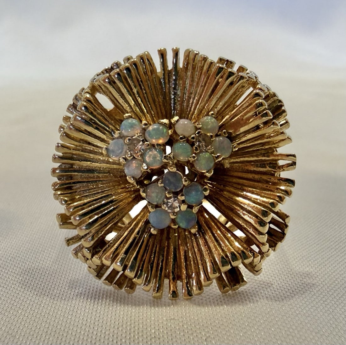 Opal and Diamond 14k Yellow Gold Ring with Multiple Stones Size 11: Opal and Diamond 14k Yellow Gold Ring with Multiple Stones Size 11 This 14k yellow gold ring features 15 opals and 3 diamonds, showcasing intricate detail, design, and workmanship. The ring is a size 