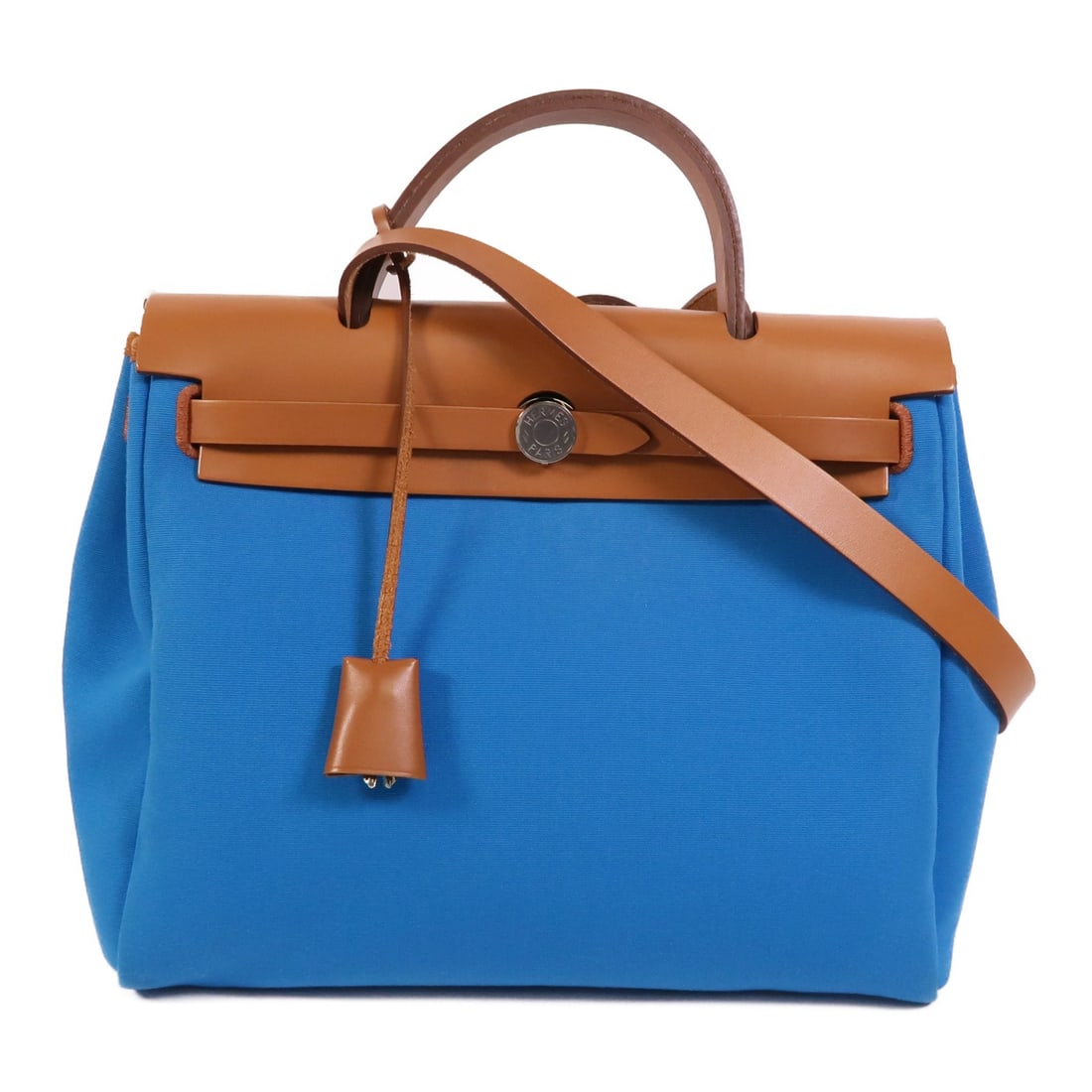 Hermes Herbag PM canvas 2 way handbag Bleu Izmir Ruby SHW: Hermes Herbag PM canvas 2 way handbag Bleu Izmir Ruby SHW The Herbag PM is a 2-way shoulder handbag made from canvas in Bleu Izmir and Ruby color accents. It features a belt hardware detail, an outsid