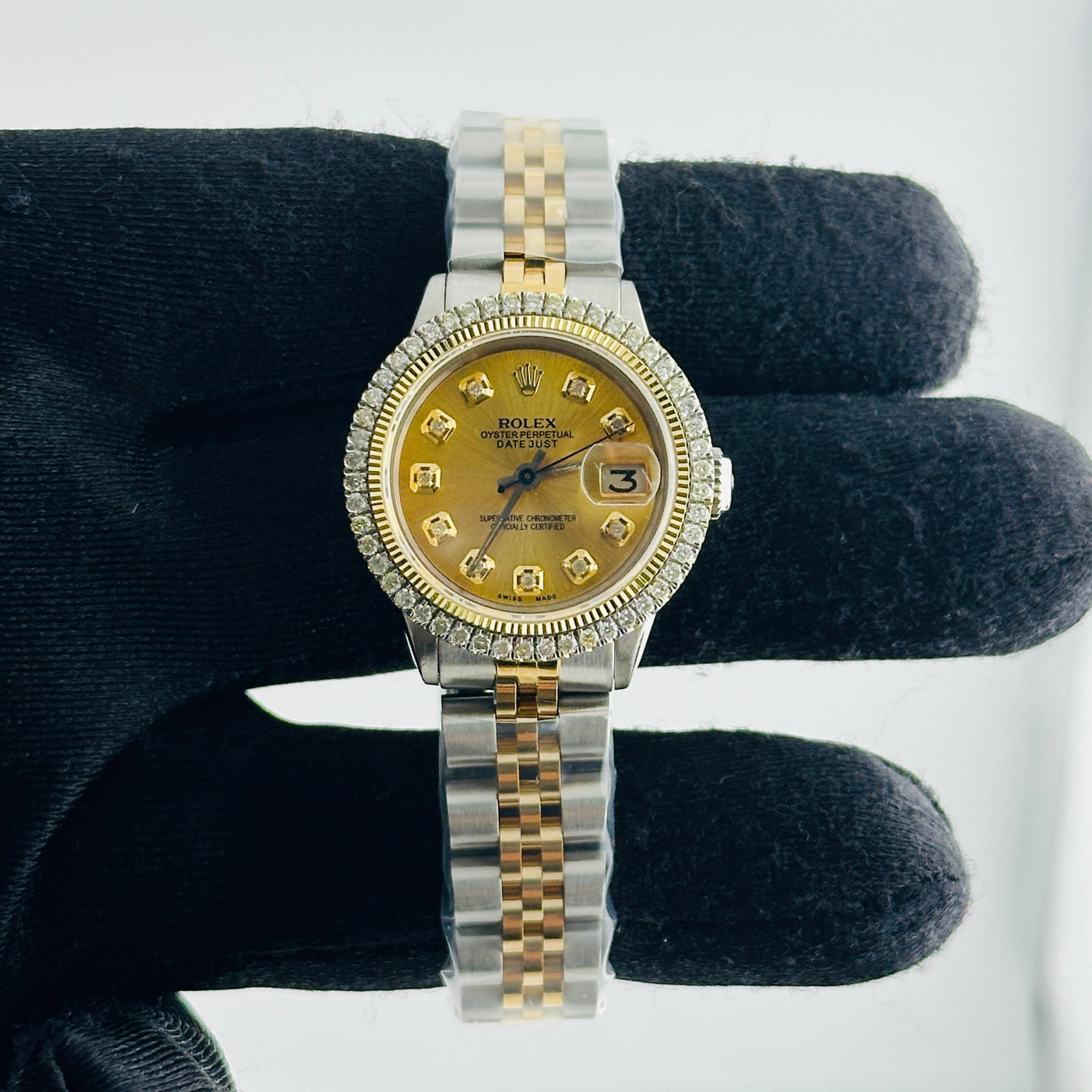 Ladies Rolex Datejust 6517 Gold Dial Diamond Markers Jubilee Bracelet: Ladies Rolex Datejust 6517 Gold Dial Diamond Markers Jubilee Bracelet This ladies' watch features an aftermarket gold dial with yellow diamond markers and an aftermarket Jubilee bracelet. It is a Role