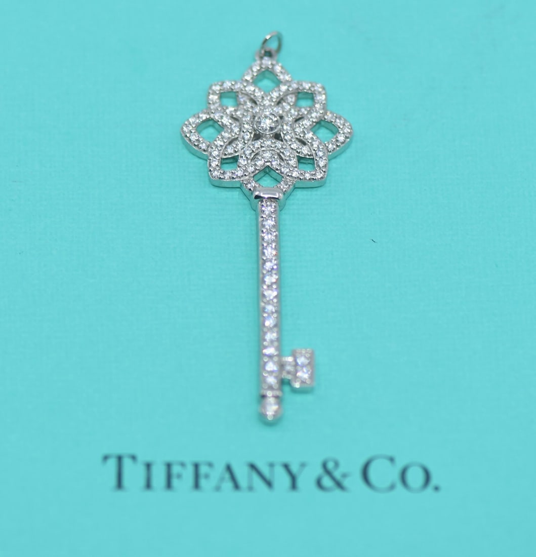Tiffany & Co Diamond Platinum Key Pendant 950 Authentic: Tiffany & Co Diamond Platinum Key Pendant 950 Authentic This exquisite Tiffany & Co. large key pendant is crafted from high-quality platinum with a metal purity of 950, ensuring both durability and el