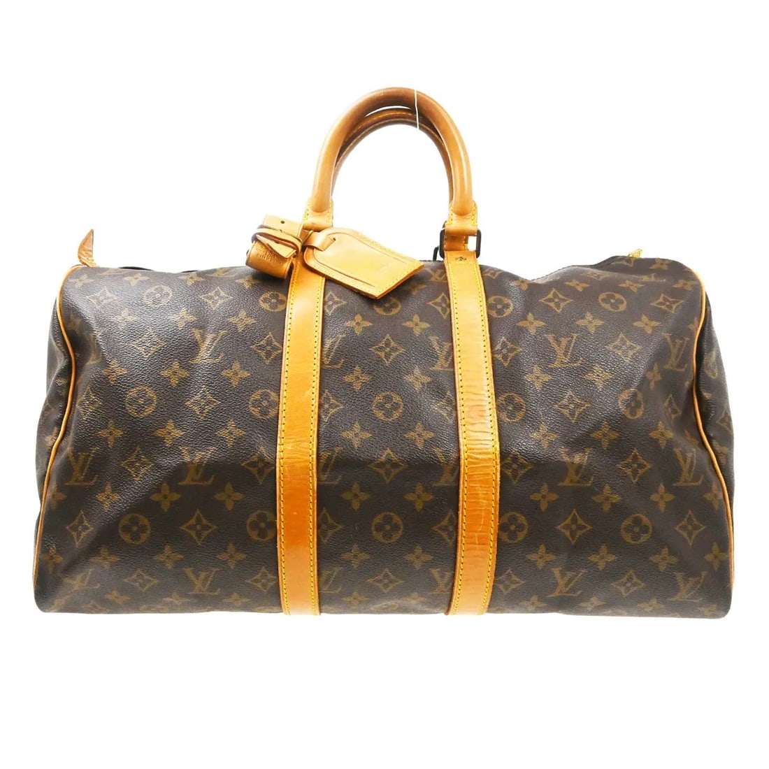 Louis Vuitton Keepall Unisex Brown Canvas Travel Bag: Louis Vuitton Keepall Unisex Brown Canvas Travel Bag Louis Vuitton Keepall in brown monogram canvas. This unisex bag is made in France and is presented in fair condition with visible wear. The exterio