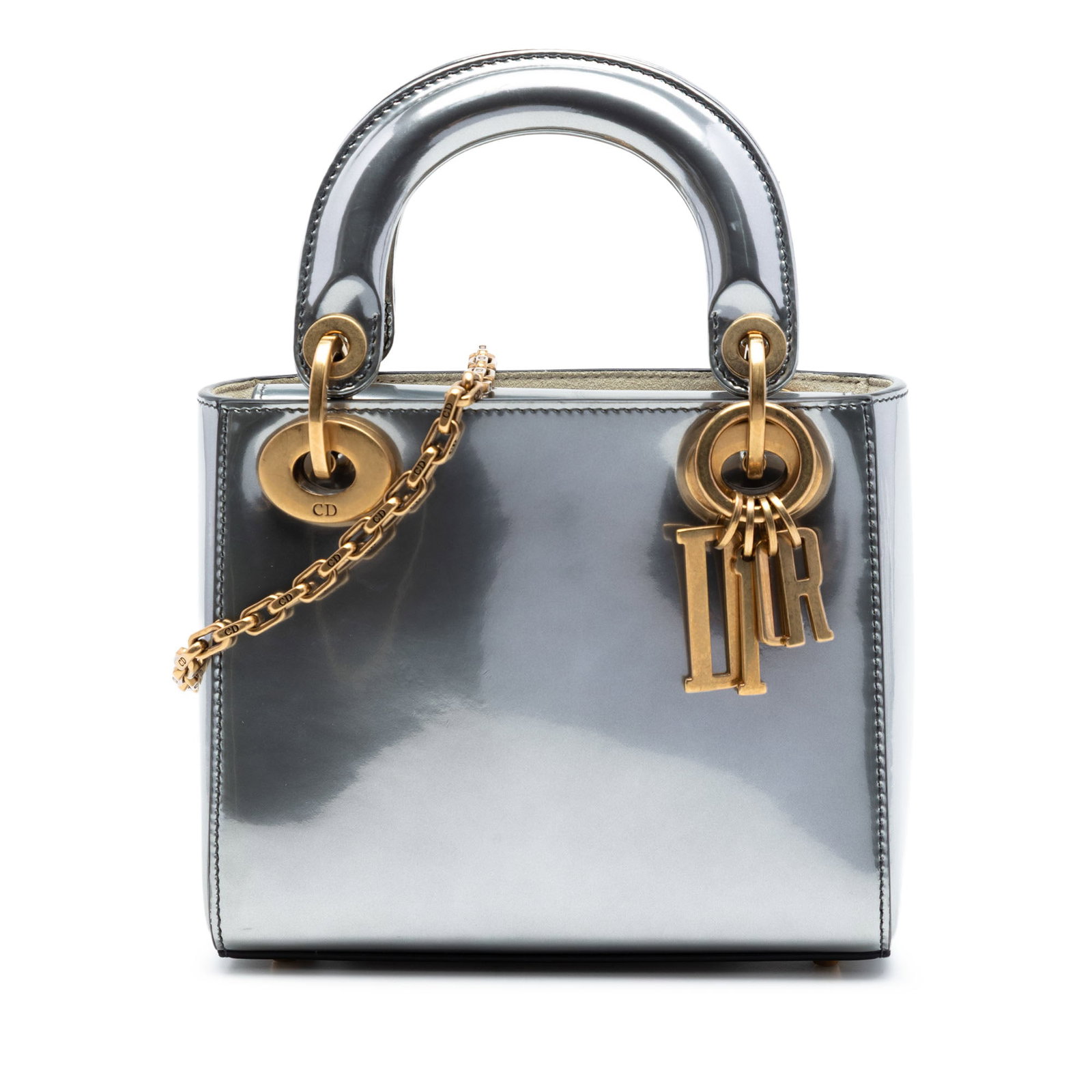 Dior Metallic Patent Mini Lady Bag Silver: Dior Metallic Patent Mini Lady Bag Silver This Mini Metallic Patent Lady Dior bag features a metallic patent leather exterior in silver, complemented by flat leather top handles and a detachable chain