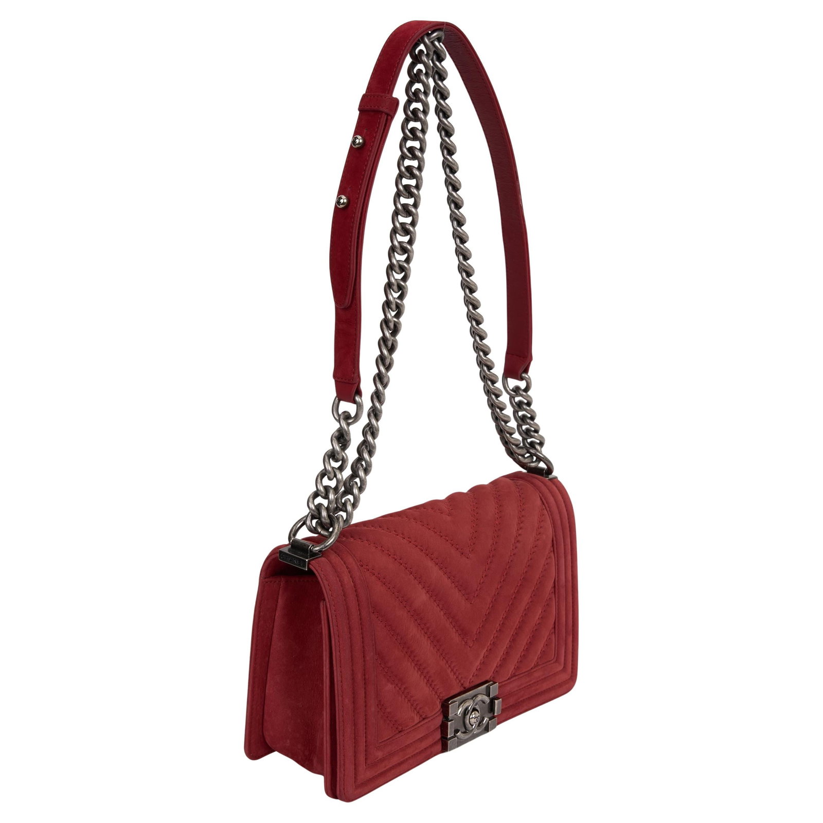 Chanel Red Suede Boy Bag with Antiqued Silver Hardware: Chanel Red Suede Boy Bag with Antiqued Silver Hardware This exquisite Chanel Red Suede Boy Bag is a stunning accessory that showcases the brand's signature style. Crafted in Italy, it features a bold 