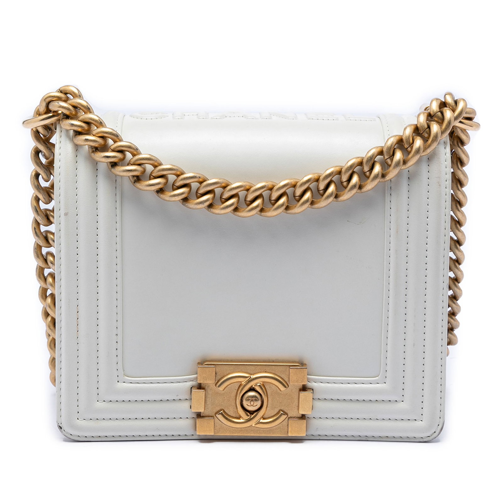 Chanel Boy Reverso Flap White Calfskin Bag: Chanel Boy Reverso Flap White Calfskin Bag This Chanel Square Calfskin Boy Reverso Flap bag features a white calf leather body, accented with a flat leather strap and gold-tone chain hardware. The des