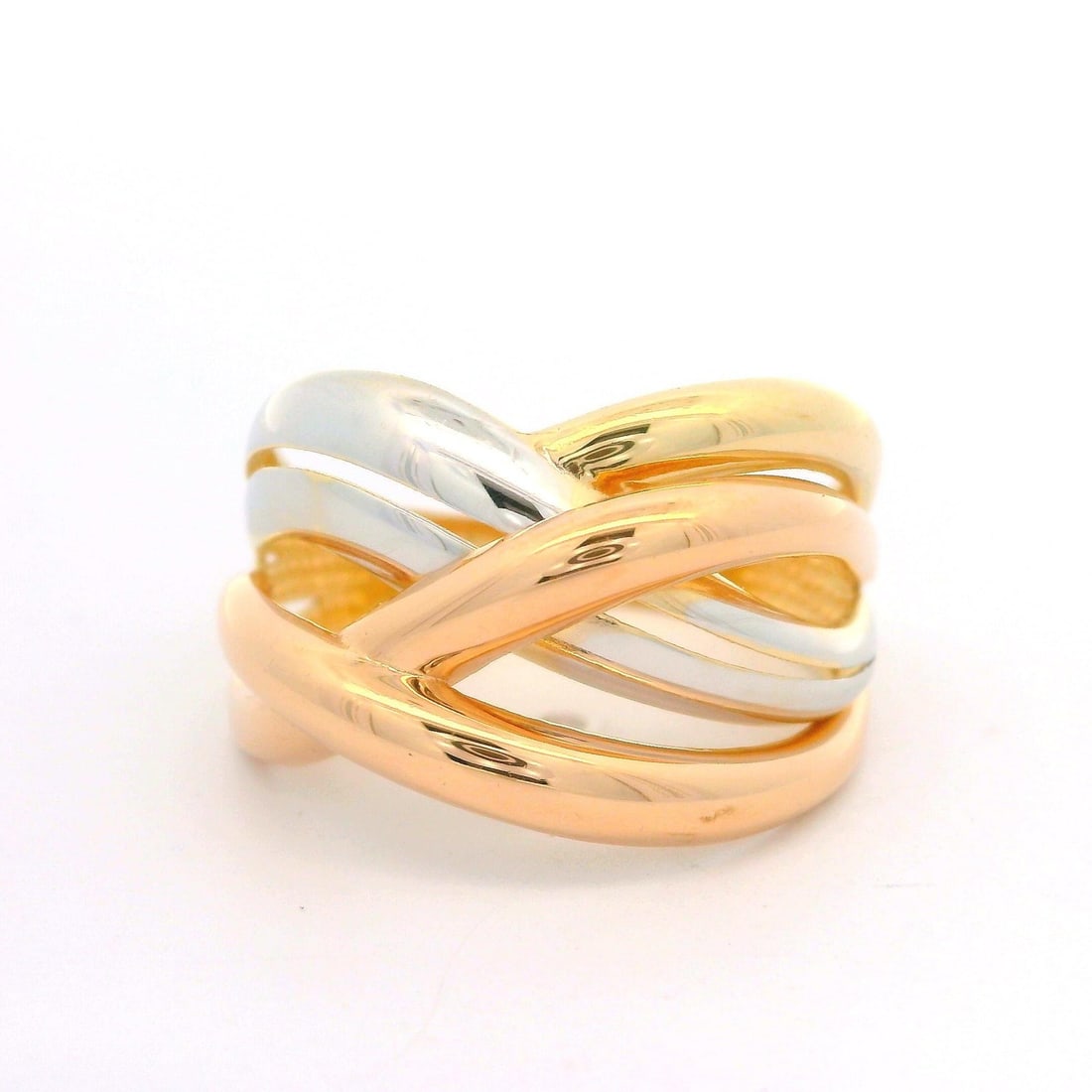 14k Multi Tone Gold Crossover Wide Open Work Band Ring: 14k Multi Tone Gold Crossover Wide Open Work Band Ring This elegant band ring features a unique crossover design crafted from solid 14k gold in a stunning multi-tone finish, combining yellow, white, a