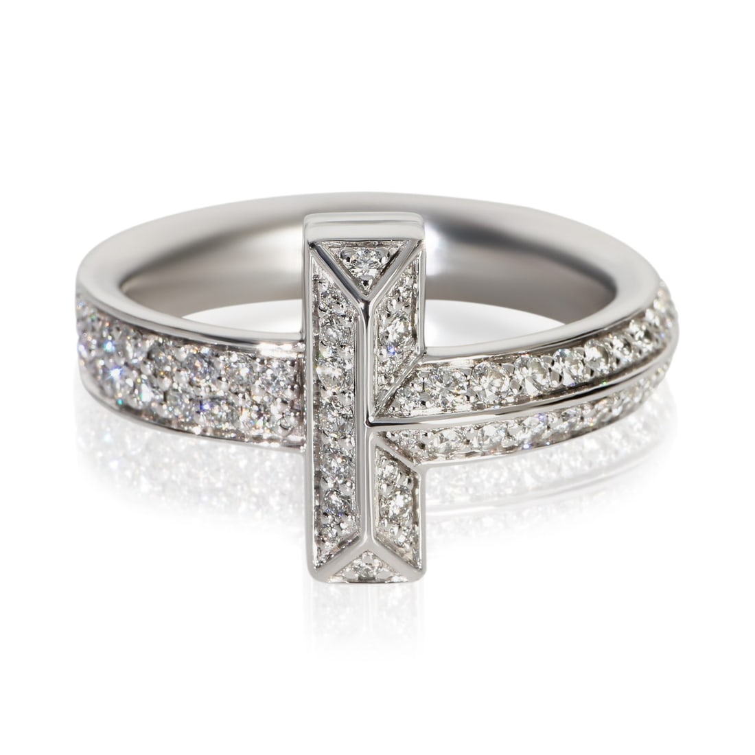 Tiffany T T1 18k White Gold Diamond Unisex Ring Size 8.5: Tiffany T T1 18k White Gold Diamond Unisex Ring Size 8.5 This Tiffany & Co. T T1 ring is crafted from 18k white gold and features round brilliant diamonds with a total carat weight of 0.58. Designed f