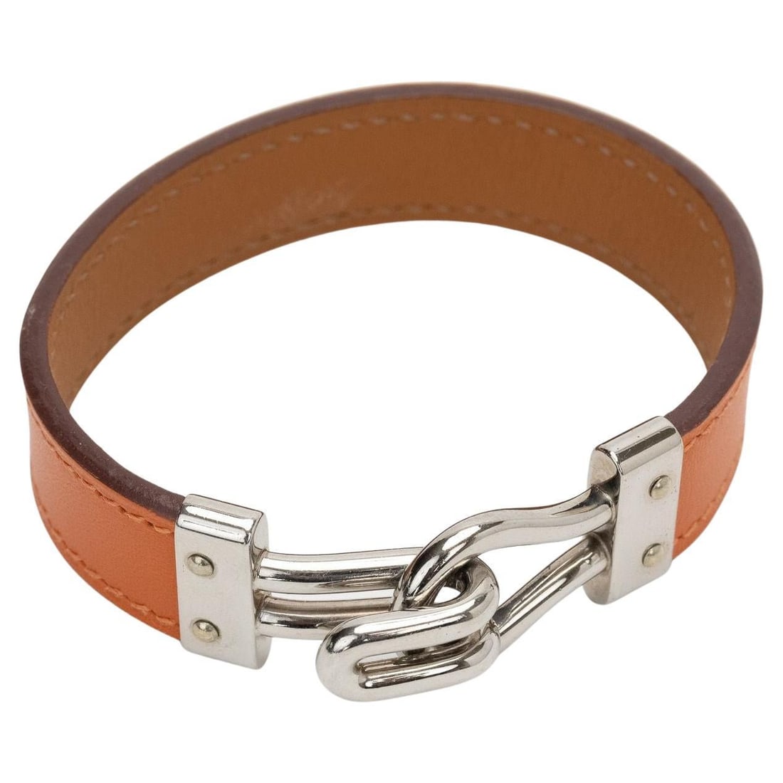 Hermes Hook Bracelet Orange Swift Palladium 2007 Medium: Hermes Hook Bracelet Orange Swift Palladium 2007 Medium Hermes Hook bracelet in orange Swift leather with palladium hardware, made in 2007. This pre-owned bracelet is in excellent condition and featur