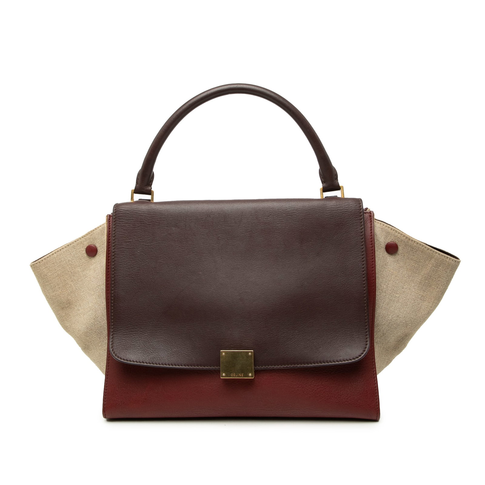 Celine Trapeze Medium Leather Satchel with Canvas Side Panels: Celine Trapeze Medium Leather Satchel with Canvas Side Panels Celine Medium Tricolor Leather Trapeze Satchel in red leather with canvas side panels. It features a rolled top handle, front flap with cl