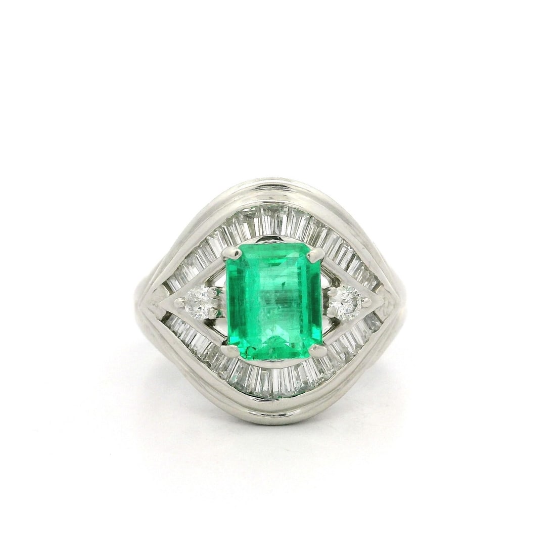 Platinum GIA Certified 2ctw Colombian Emerald Diamond Flared Cocktail Ring: Platinum GIA Certified 2ctw Colombian Emerald Diamond Flared Cocktail Ring This stunning cocktail ring features a high-quality 2 carat total weight Colombian emerald, elegantly showcased in an octagon