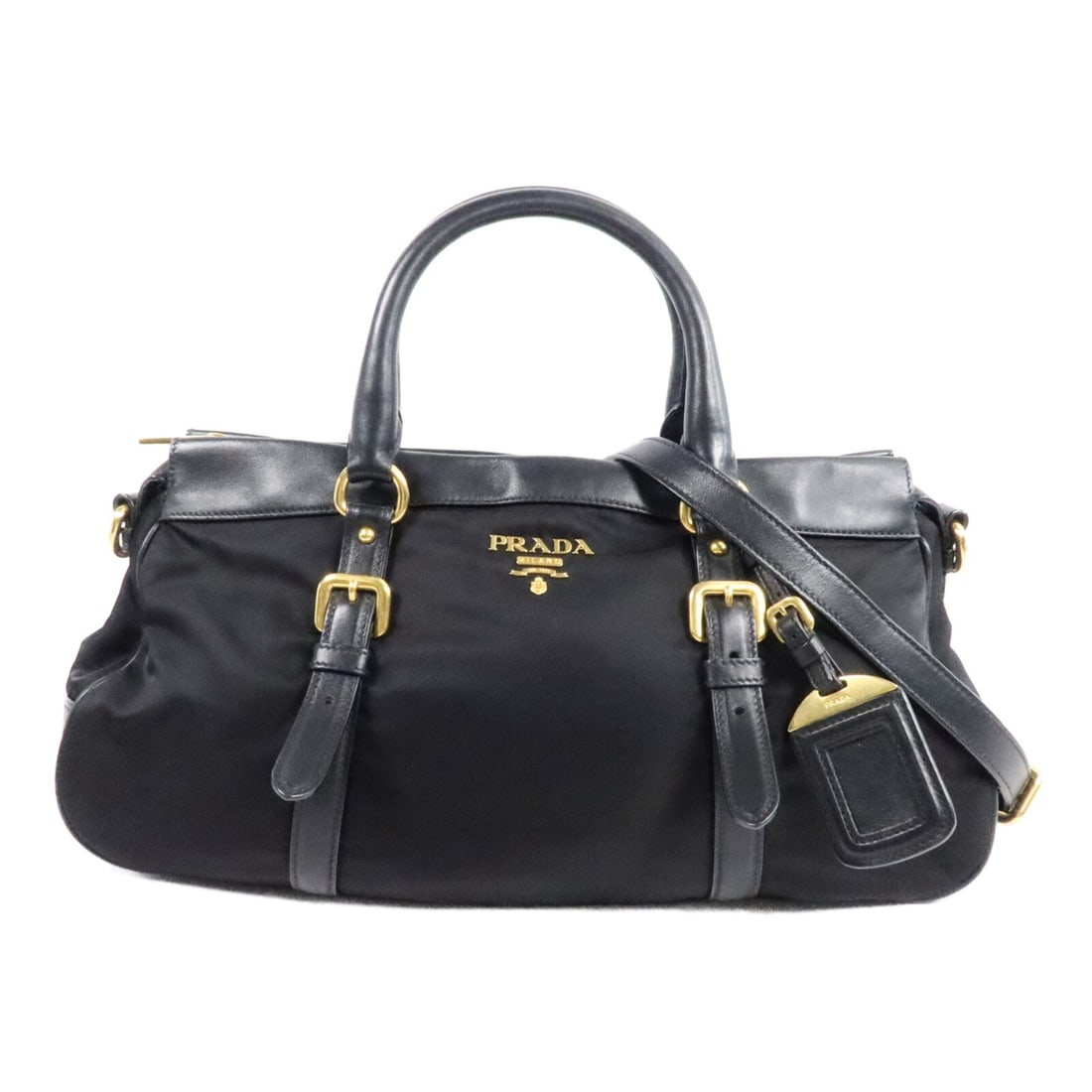 PRADA Black Nylon 2 Way Shoulder Bag with Strap: PRADA Black Nylon 2 Way Shoulder Bag with Strap Black PRADA 2-way shoulder bag made from nylon, with a practical design and included shoulder strap and name tag. The bag features a fastener closure, o