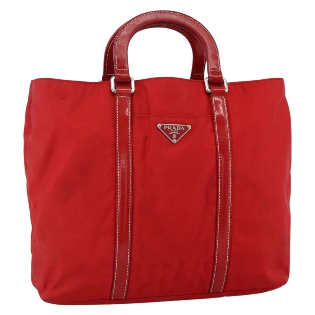 Prada Red Nylon Hand Bag Silver Tone Made in Italy: Prada Red Nylon Hand Bag Silver Tone Made in Italy Prada hand bag in nylon with a red and silver color scheme, made in Italy. The bag measures approximately 26 cm W x 24 cm H x 7 cm D, with a handle d