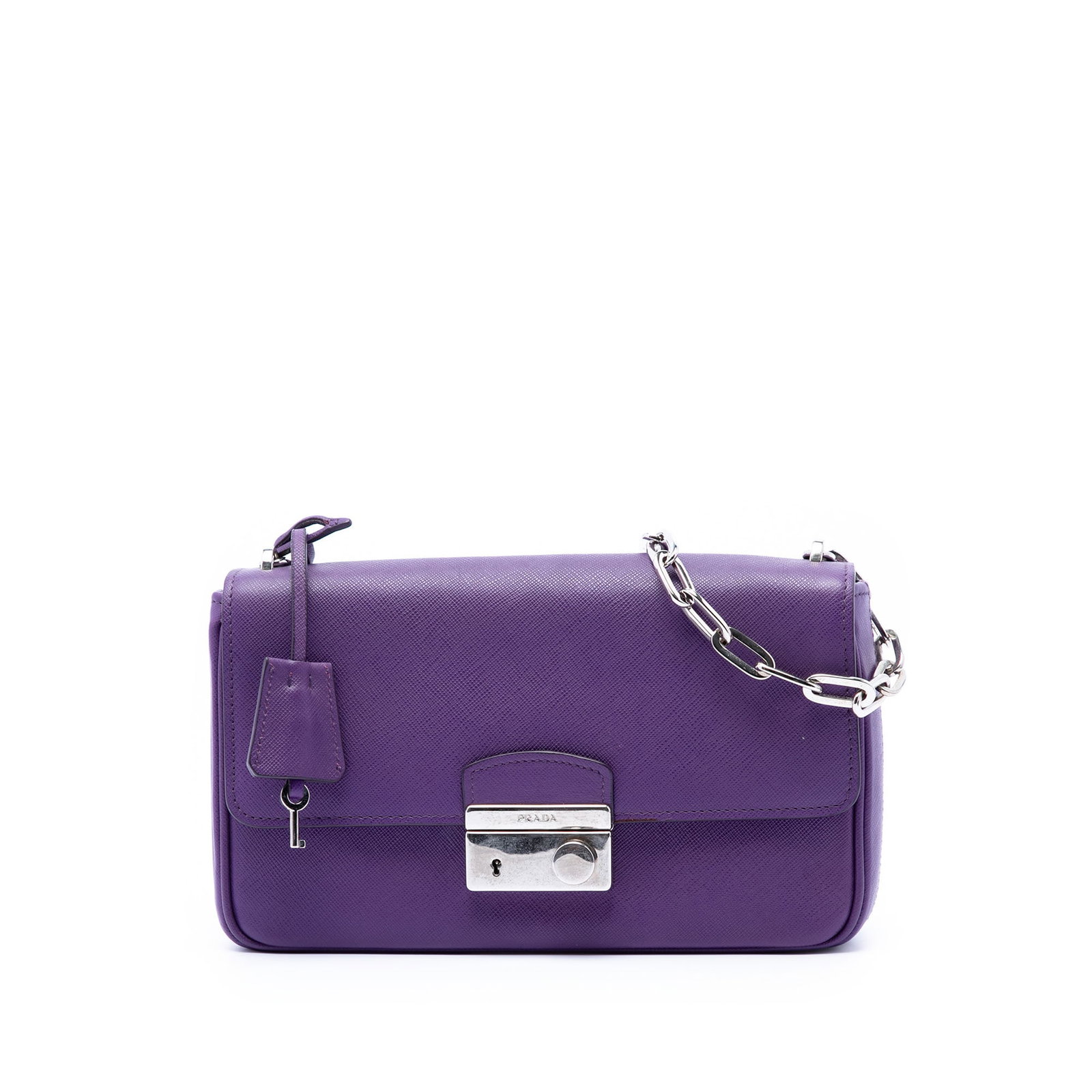 Prada Saffiano leather crossbody bag with chain strap purple: Prada Saffiano leather crossbody bag with chain strap purple Prada Saffiano Sound Lock Crossbody in purple leather with a structured silhouette and practical pocket layout. The bag features a chain li