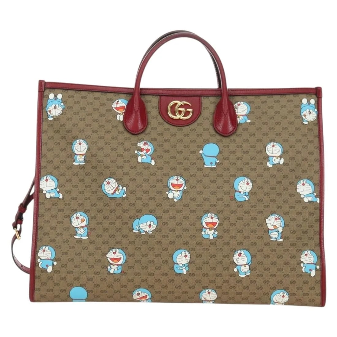 Doraemon Mini GG Canvas Tote Bag by Gucci Beige Italy: Doraemon Mini GG Canvas Tote Bag by Gucci Beige Italy This Gucci Doraemon Tote features the iconic mini GG coated canvas in beige, accented with a Doraemon print. Designed for women, it offers both st