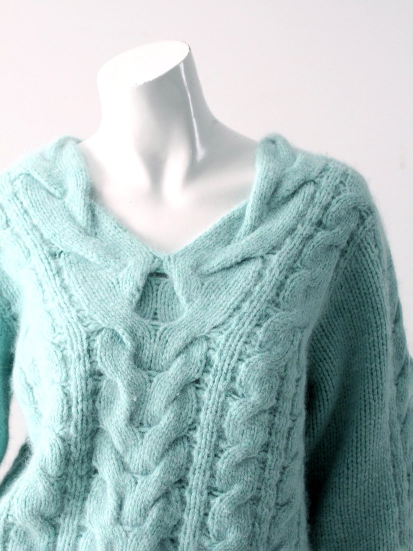 Vintage Turquoise Cable Knit Pullover Sweater Angora Blend: Vintage Turquoise Cable Knit Pullover Sweater Angora Blend This vintage cable knit sweater is ultra-soft and features a striking turquoise color. The pullover jumper is designed with a flattering v-ne