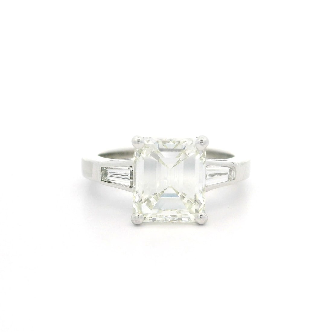 GIA Certified Platinum Engagement Ring with 2.57ct Emerald Diamond and Baguettes: GIA Certified Platinum Engagement Ring with 2.57ct Emerald Diamond and Baguettes Vintage engagement ring crafted in solid .900+ platinum and set with a natural old emerald cut diamond accented by tape
