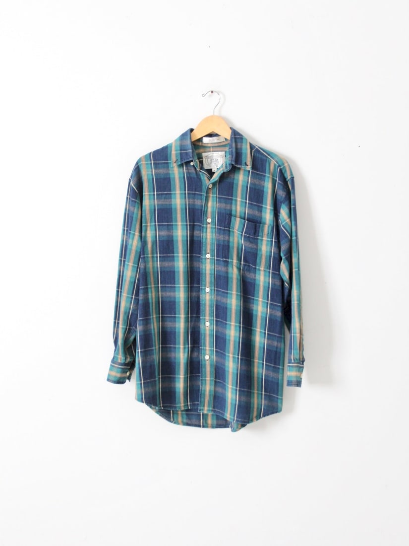 Retro John Ashford Blue Plaid Button Up Shirt 1980s: Retro John Ashford Blue Plaid Button Up Shirt 1980s Discover a timeless addition to your wardrobe with this Vintage John Ashford Plaid Shirt, a classic piece from the late 1980s. Crafted from thick co
