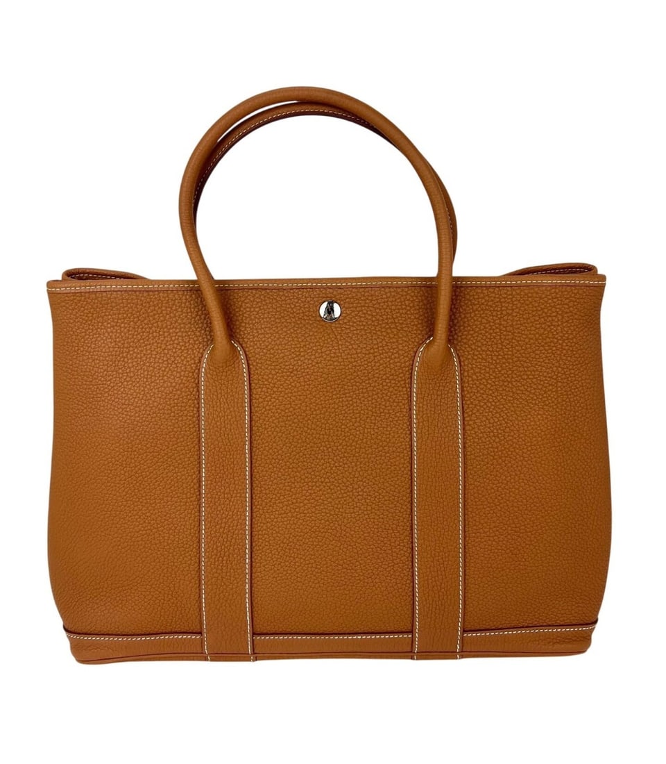 Hermes Garden Party MM 36 Gold Negonda Leather Tote Bag: Hermes Garden Party MM 36 Gold Negonda Leather Tote Bag Hermes Negonda Garden Party MM 36 tote bag in gold leather with a glazed finish. It features a rectangle shape, snap closure, double handles, po