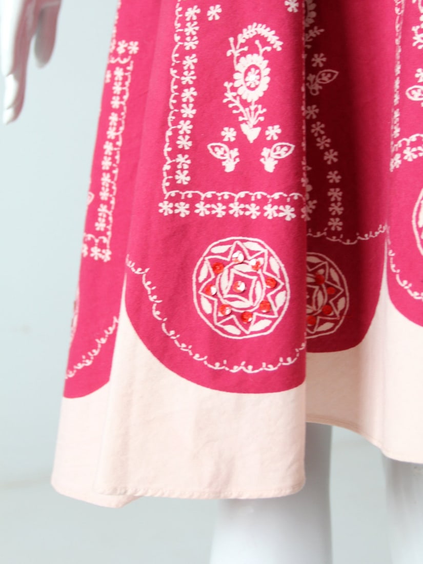 Red Bohemian Floral Full Skirt With Sequins XS: Red Bohemian Floral Full Skirt With Sequins XS This vintage full skirt features a rich red tone with a soft blush border, adorned with a stylized floral and medallion print. Subtle sequin accents add 