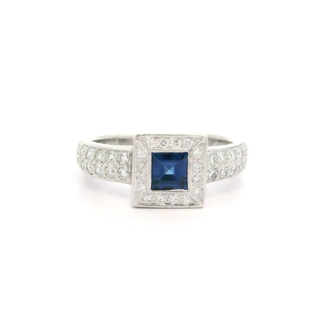 Platinum 0.80ctw Square Blue Sapphire Diamond Halo Ring: Platinum 0.80ctw Square Blue Sapphire Diamond Halo Ring This exquisite geometric ring features a stunning square natural sapphire at its center, beautifully complemented by a halo of sparkling diamond