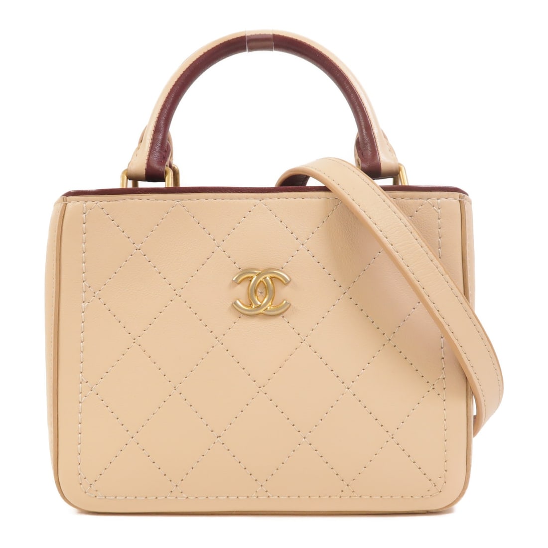 CHANEL CC Calfskin 2 Way Tote Shoulder Bag Beige Burgundy: CHANEL CC Calfskin 2 Way Tote Shoulder Bag Beige Burgundy A CHANEL CC GHW Shopping Tote 2 Way Shoulder Bag in beige/burgundy calfskin leather. It features a shopping tote design with a shoulder strap 