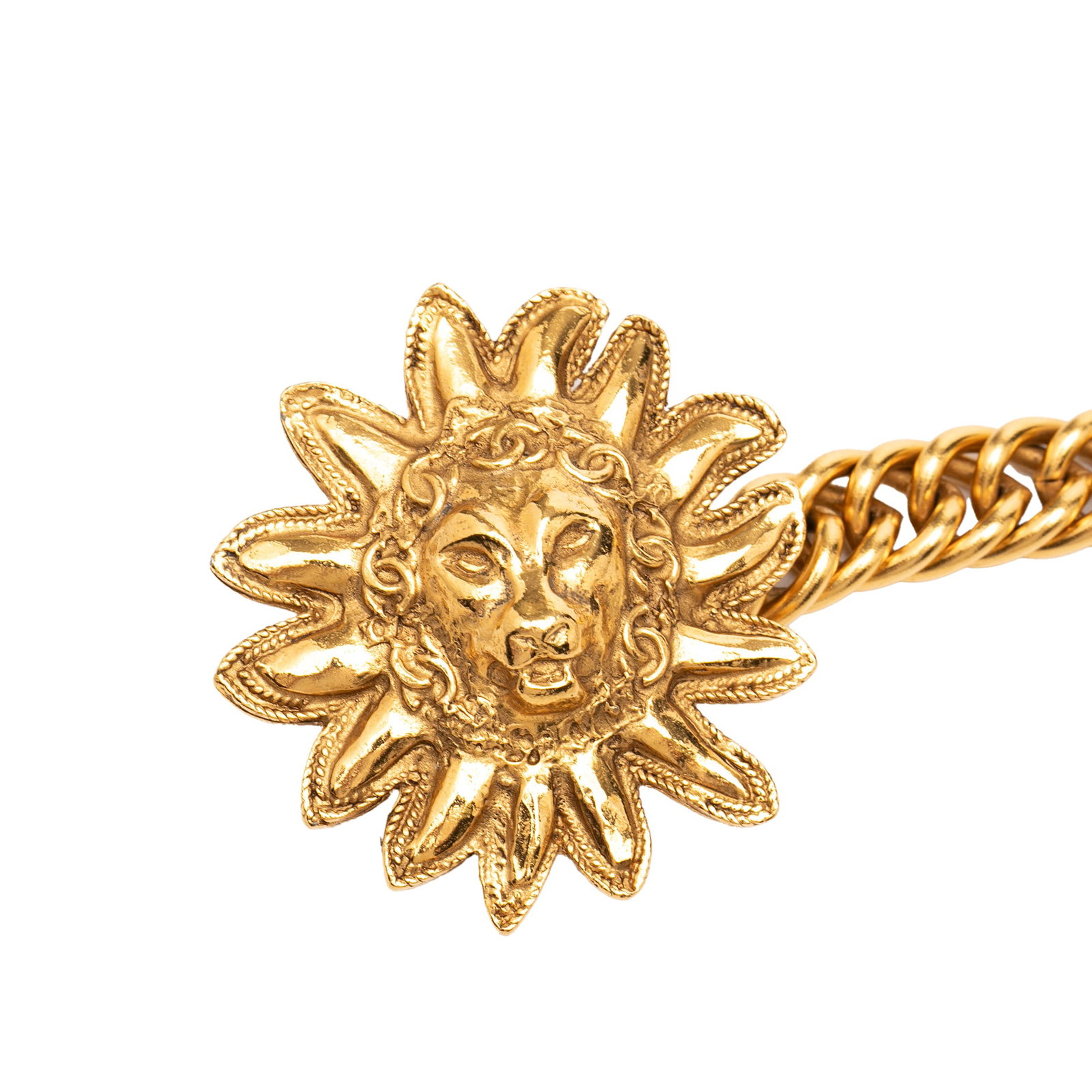 Chanel Gold Tone Lion Sun Medallion Necklace: Chanel Gold Tone Lion Sun Medallion Necklace This Chanel necklace features a gold-tone metal body with a distinctive lion sun medallion pendant and a hook closure. Originating from France, it is categ