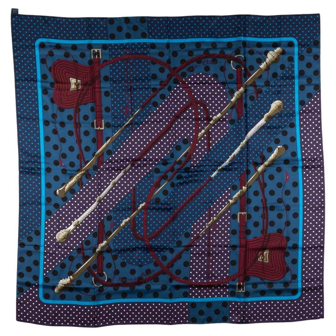 Hermes Clic Clac 52 in Silk Shawl Navy: Hermes Clic Clac 52 in Silk Shawl Navy This Hermes "Clic Clac" shawl features a striking red and blue design, expertly crafted from 100% silk. The piece is finished with hand-rolled edges, showcasing 