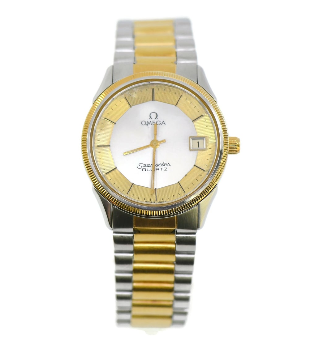 Omega Seamaster Two Tone Stainless Steel Quartz Watch Ref 1380: Omega Seamaster Two Tone Stainless Steel Quartz Watch Ref 1380 The Omega Seamaster is a sophisticated two-tone wristwatch, featuring a sleek stainless steel case and band. This model is powered by a p