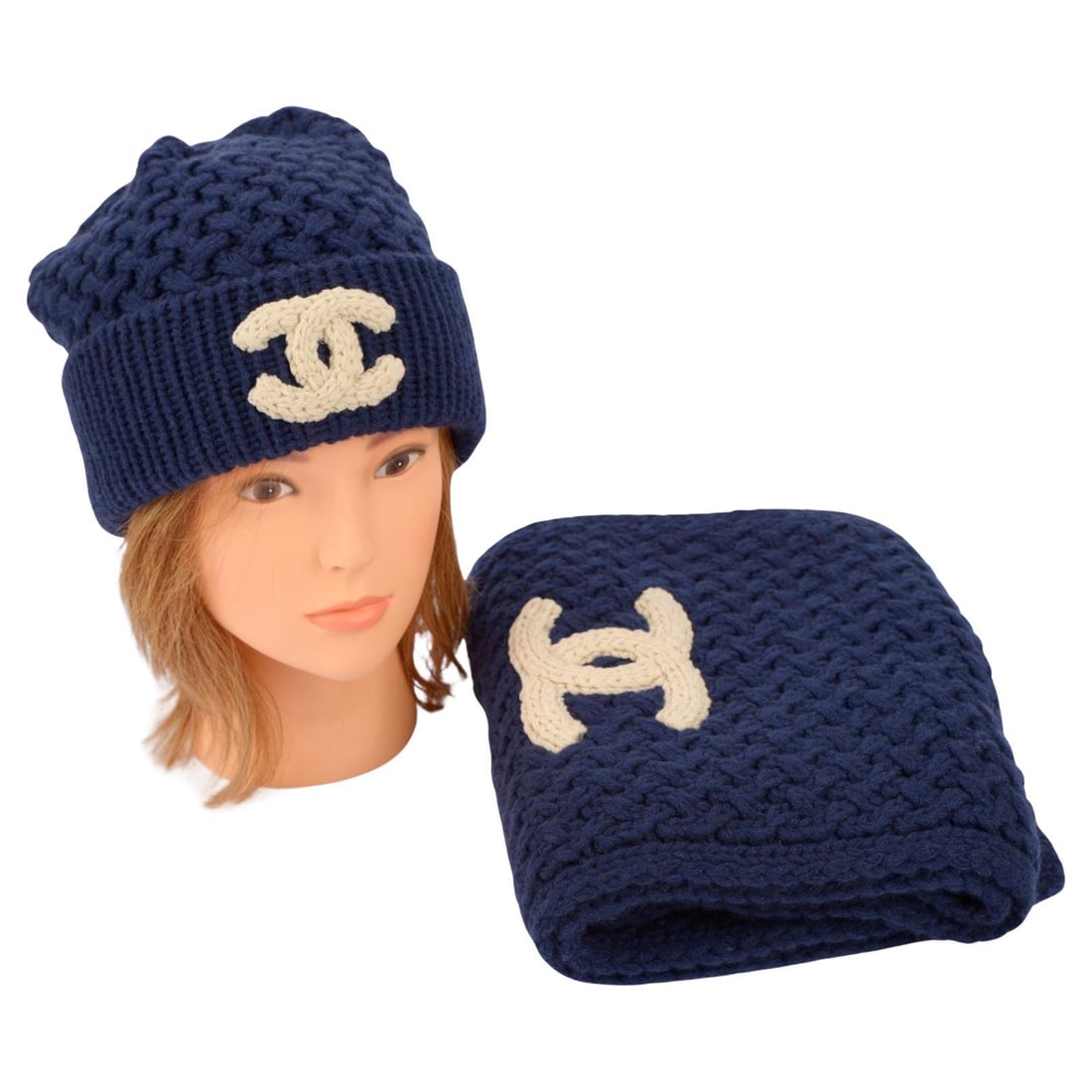 Chanel Navy Knit Beanie and Scarf Set with Creme CC Applique: Chanel Navy Knit Beanie and Scarf Set with Creme CC Applique Elevate your winter wardrobe with this exquisite Chanel Knit Beanie and Scarf Set. Crafted in Italy, this set features a stunning navy blue