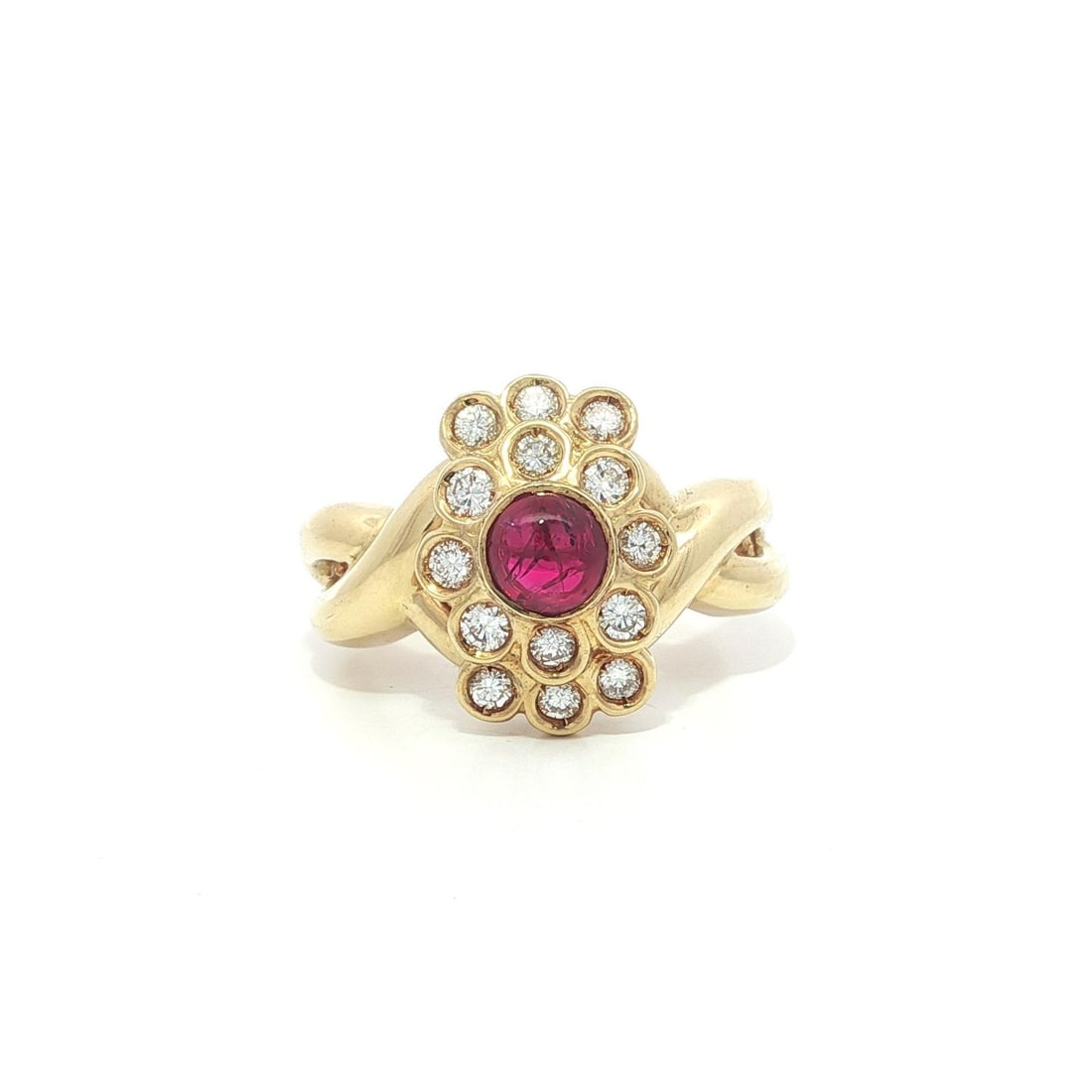 Cocktail Ring with Cabochon Ruby and Diamonds in 18k Yellow Gold: Cocktail Ring with Cabochon Ruby and Diamonds in 18k Yellow Gold This 18k yellow gold cocktail ring features a vibrant round cabochon-cut natural ruby bezel set at the center, surrounded by fourteen r