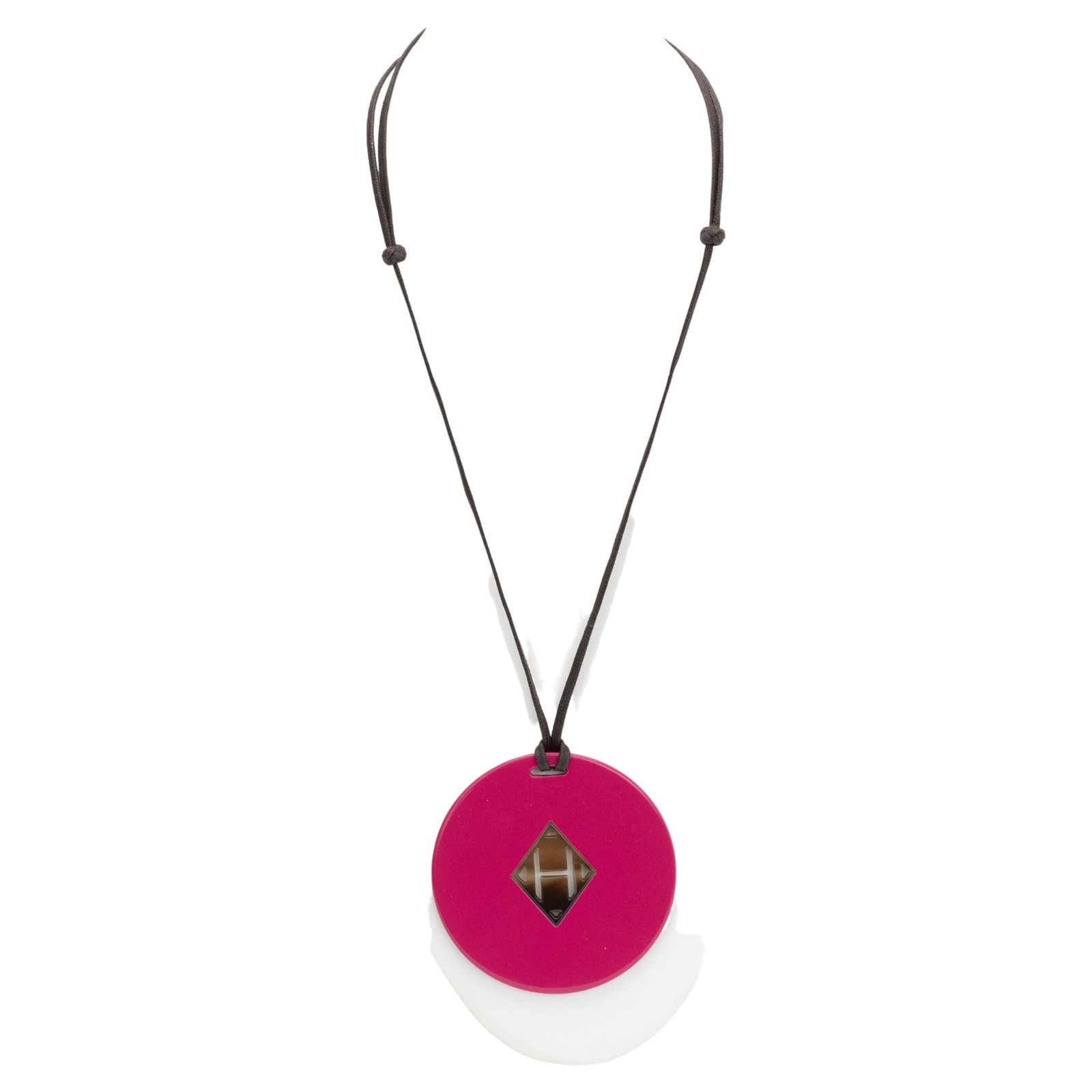 Hermes Buffalo H Logo Pink Necklace: Hermes Buffalo H Logo Pink Necklace Pre-owned Hermes buffalo necklace in pink featuring a circular design with an H logo at the center. This 21st century piece is in excellent condition. Specification