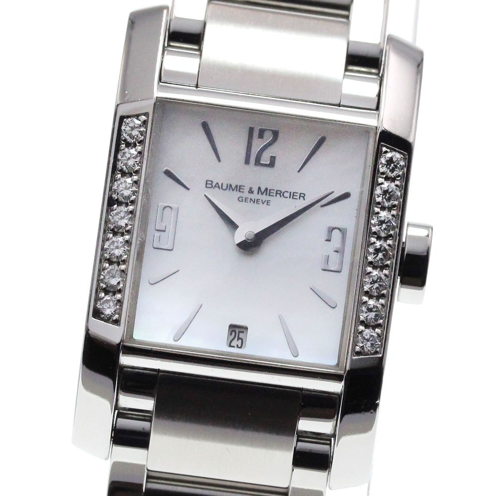 Baume Mercier Hampton quartz date ladies wristwatch stainless steel: Baume Mercier Hampton quartz date ladies wristwatch stainless steel This Baume & Mercier Hampton women's wristwatch features a stainless steel case and band, paired with a white shell dial. The watch 