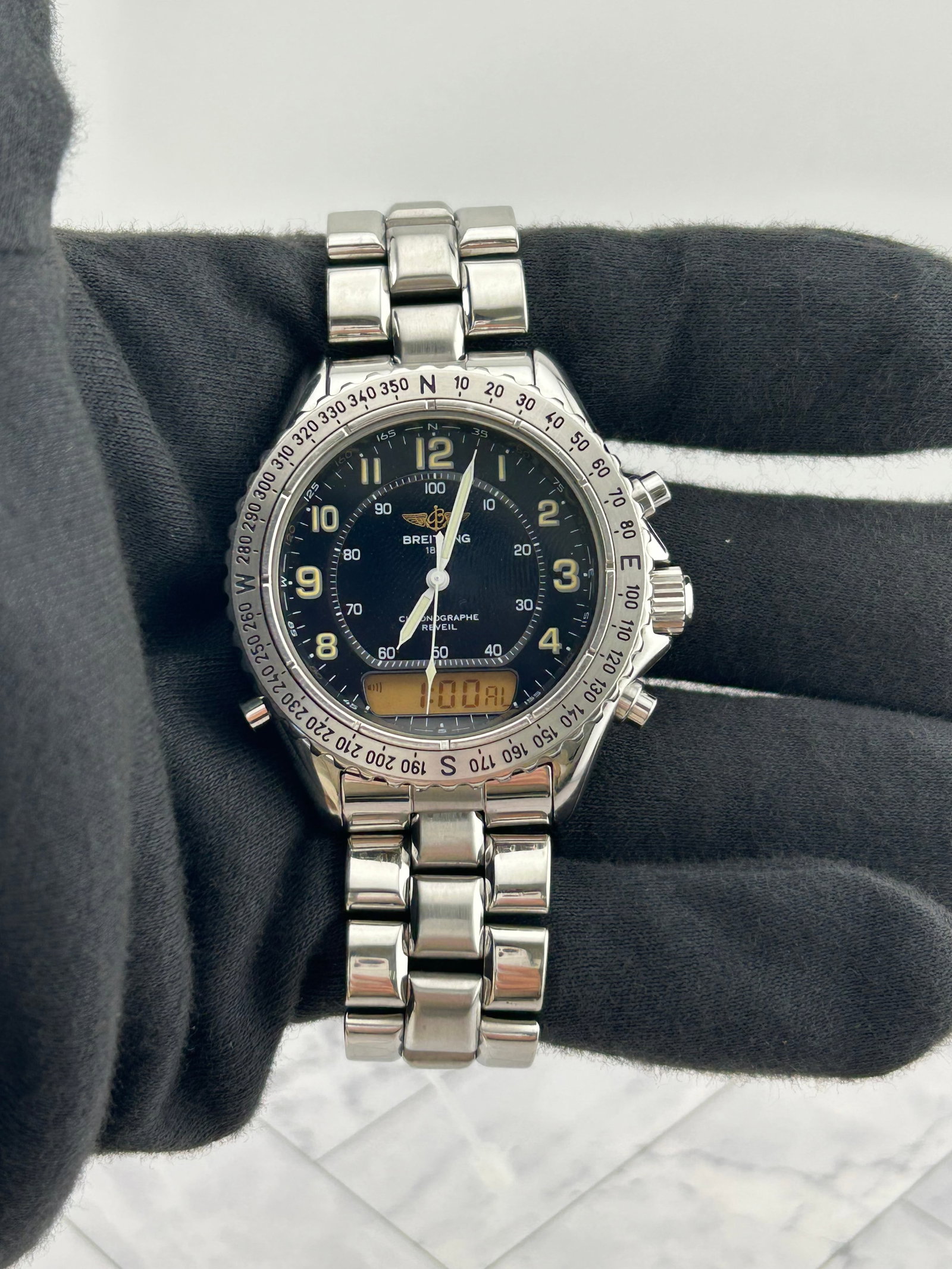 Breitling A51035 Intruder Reveil mens watch black dial steel bracelet: Breitling A51035 Intruder Reveil mens watch black dial steel bracelet Breitling Intruder Reveil men's watch with a black dial, rotating bezel, and stainless steel bracelet. Reference A51035 from the I